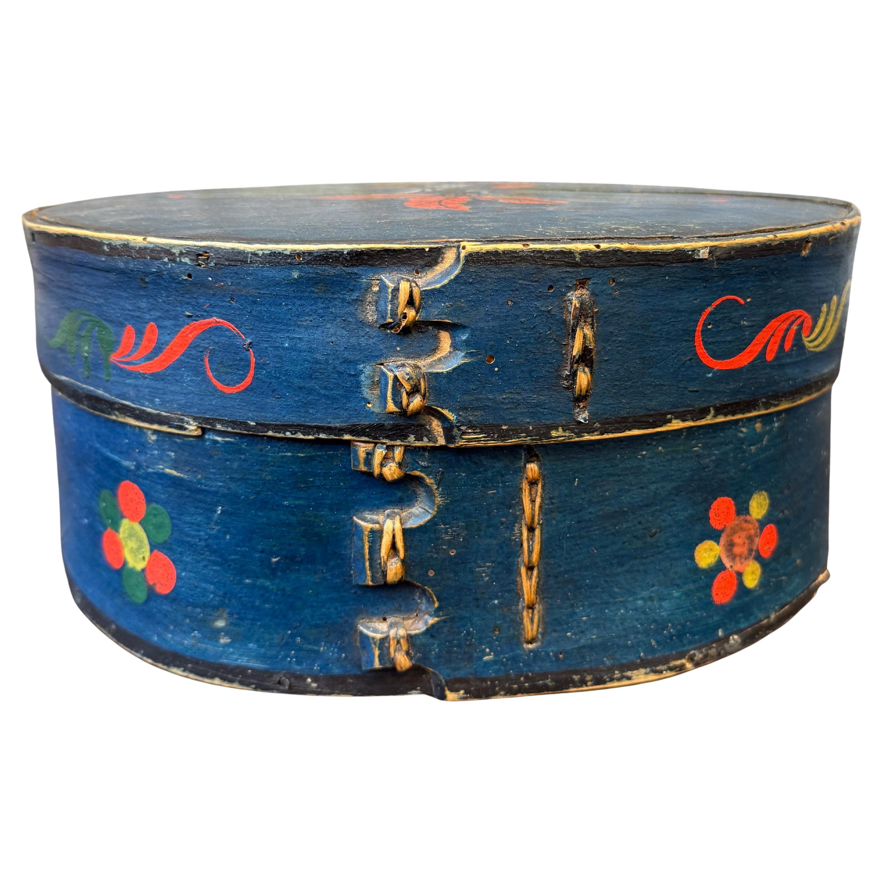 A Swedish original hand painted and carved Folk Art bridal bentwood box from the North Western regions of Sweden, bordering Norway. This 19th Century Scandinavian rural collectible was normally given as a wedding present. The box is hand crafted and