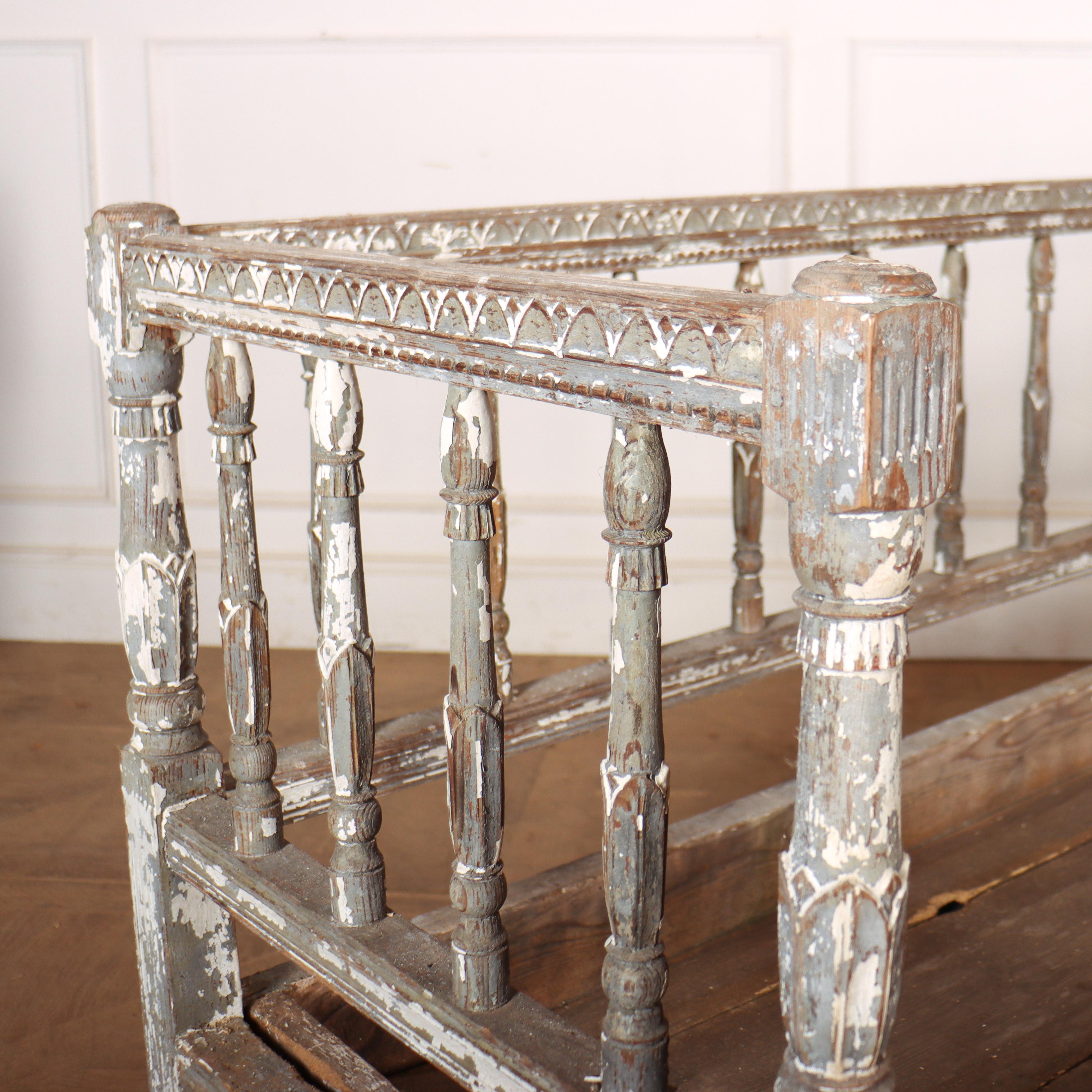 Early 19th century carved Swedish settle with original grey paint with traces of later white paint. 1820.

Seat height is 16