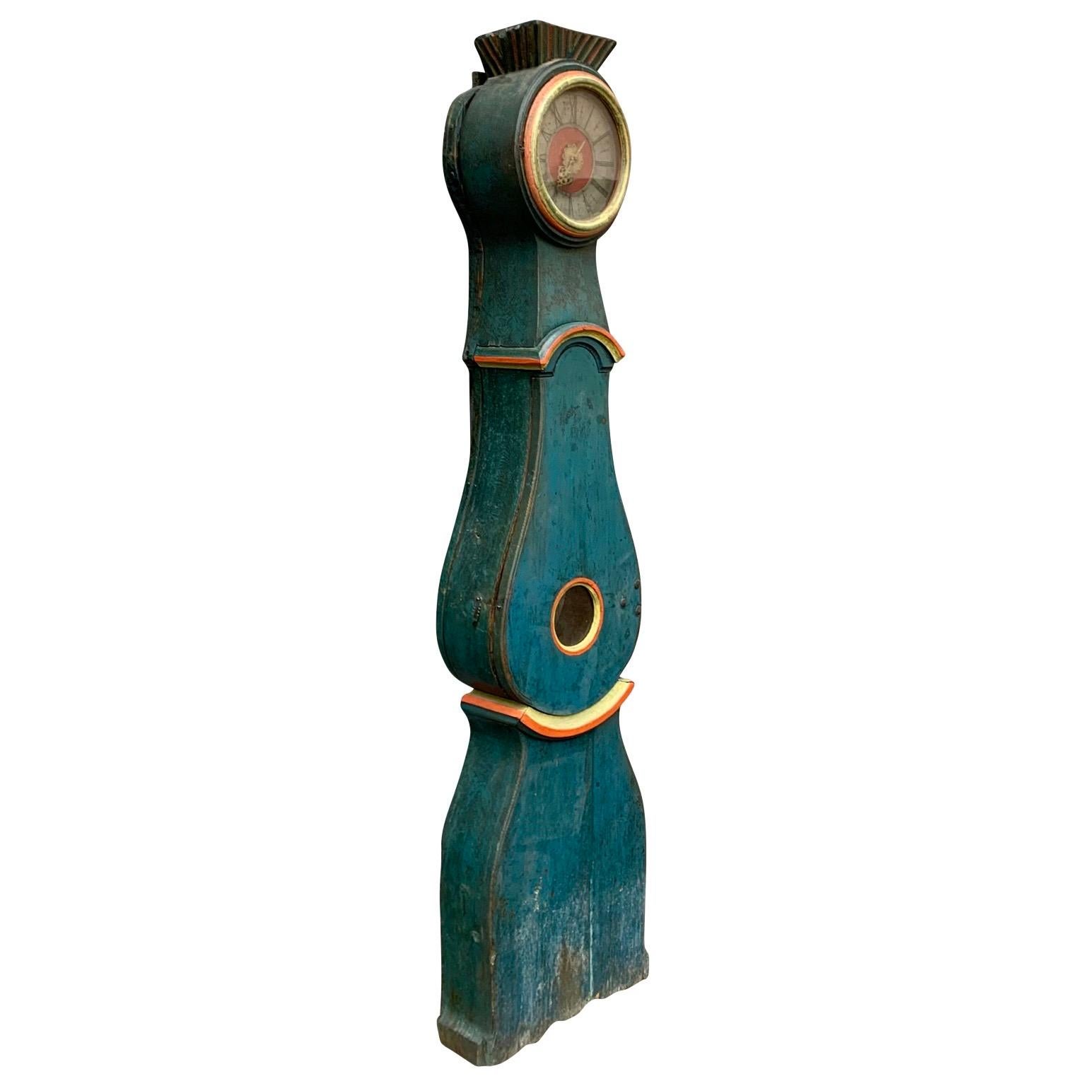 An early 19th Century original painted long case clock or Grandfather clock from Sweden. This folk art clock is more unique because it originally was  made to celebrate the wedding between a young couple in 1825. 
The initialsl of both (the man