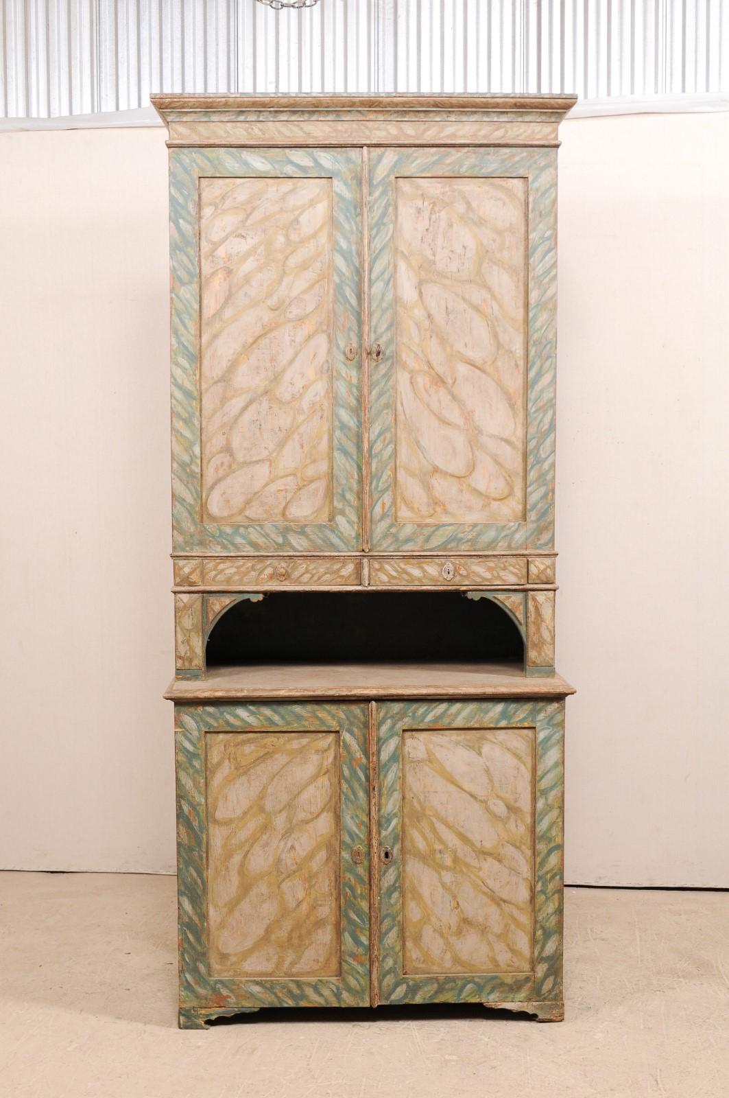 An antique Swedish hutch cabinet with decorative hand-painted 