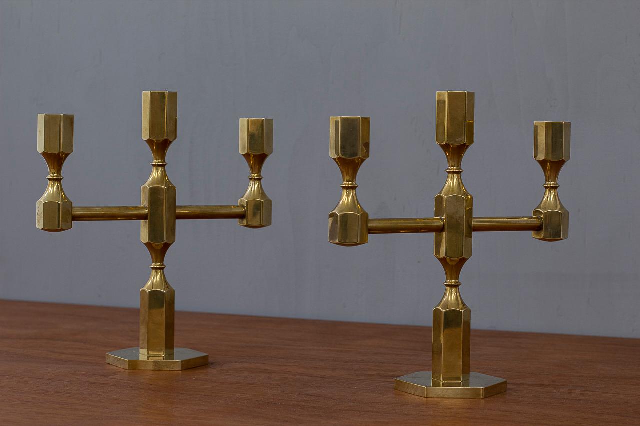 Striking pair of candelabras designed by Lars Bergsten for Gusum.
Produced in Sweden in 1986. Made from solid brass. 
Engraved, signed and dated on the bottom.

Condition: Very good vintage patinated condition, minor signs of wear.