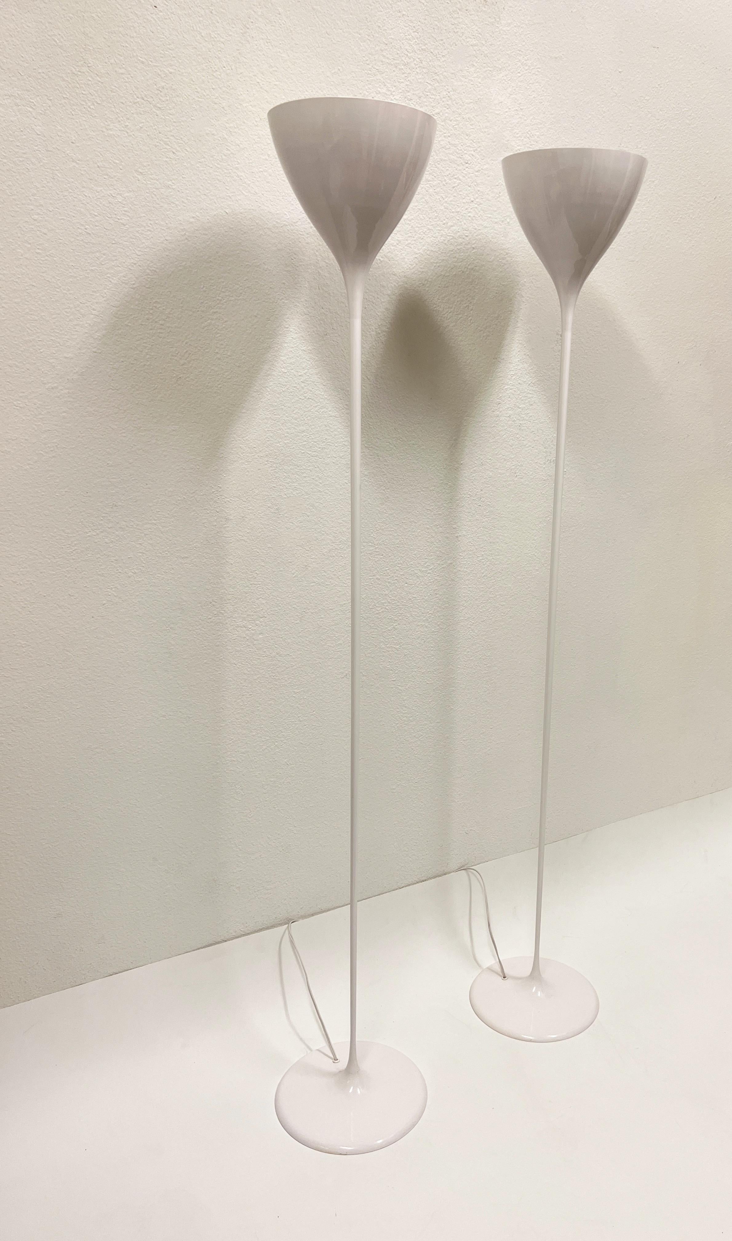 1970’s Sculptural pair white powdered coated torchieres floor lamps by Swedish Architect Max Bill. 
Newly rewired. They take 100w Max Edison lightbulb. 
Measurements: 64.75” high, 9.75” diameter shade, 11” diameter base.