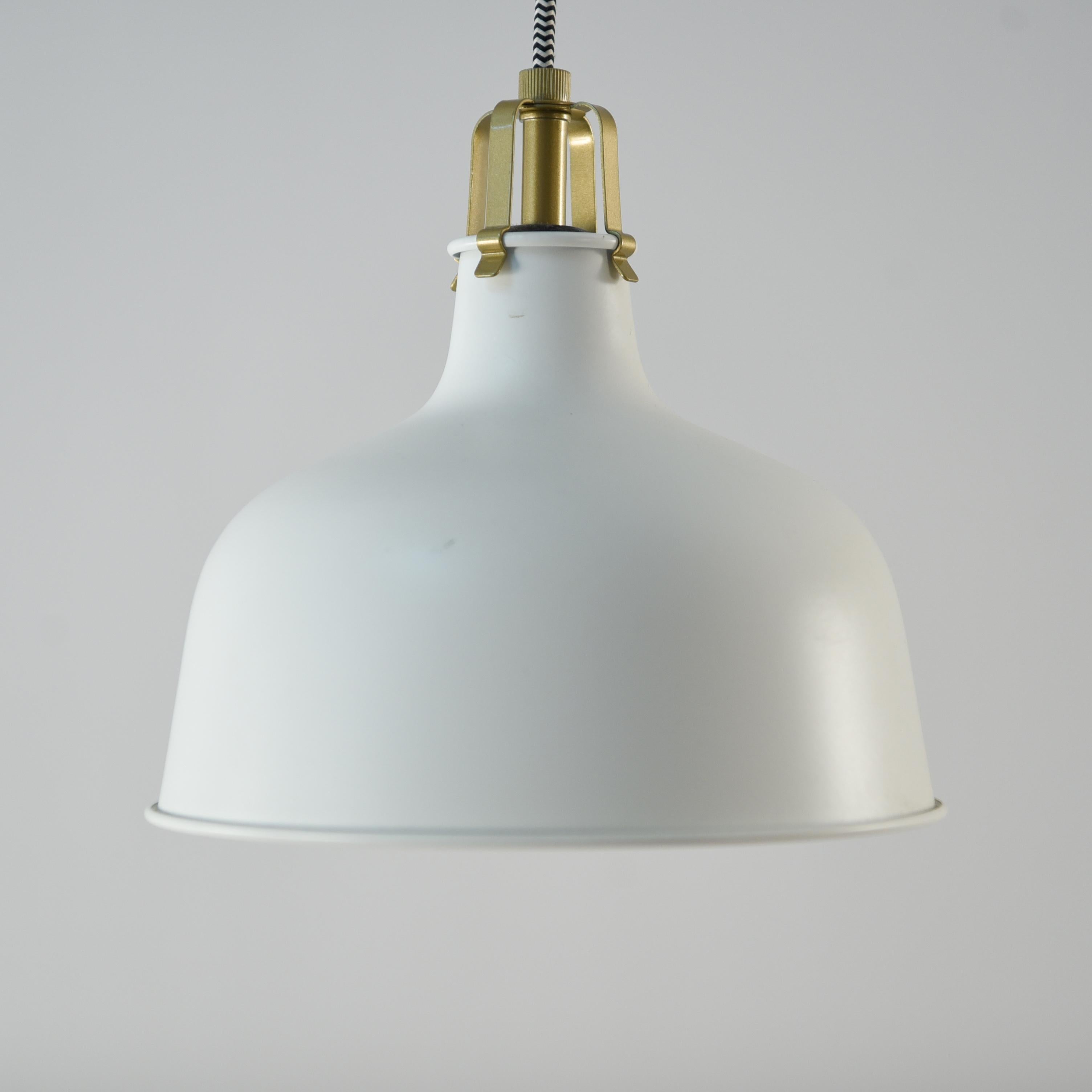 This Swedish pendant light is a classic bell form in white. This piece has a versatile, timeless design.