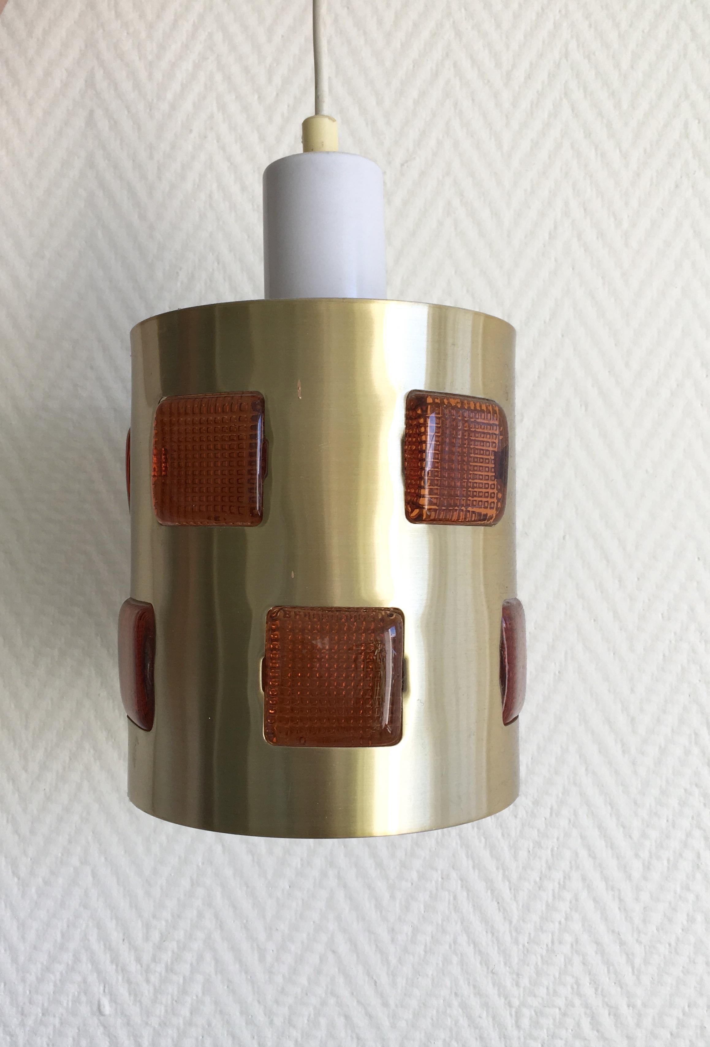 Small metal and glass lamp which was designed and manufactured in Sweden, 1960s. The lamp remains in good condition and features a sticker 'Made in Sweden'. Normal signs of age and use (some small scratches and minor dents). Rare piece.