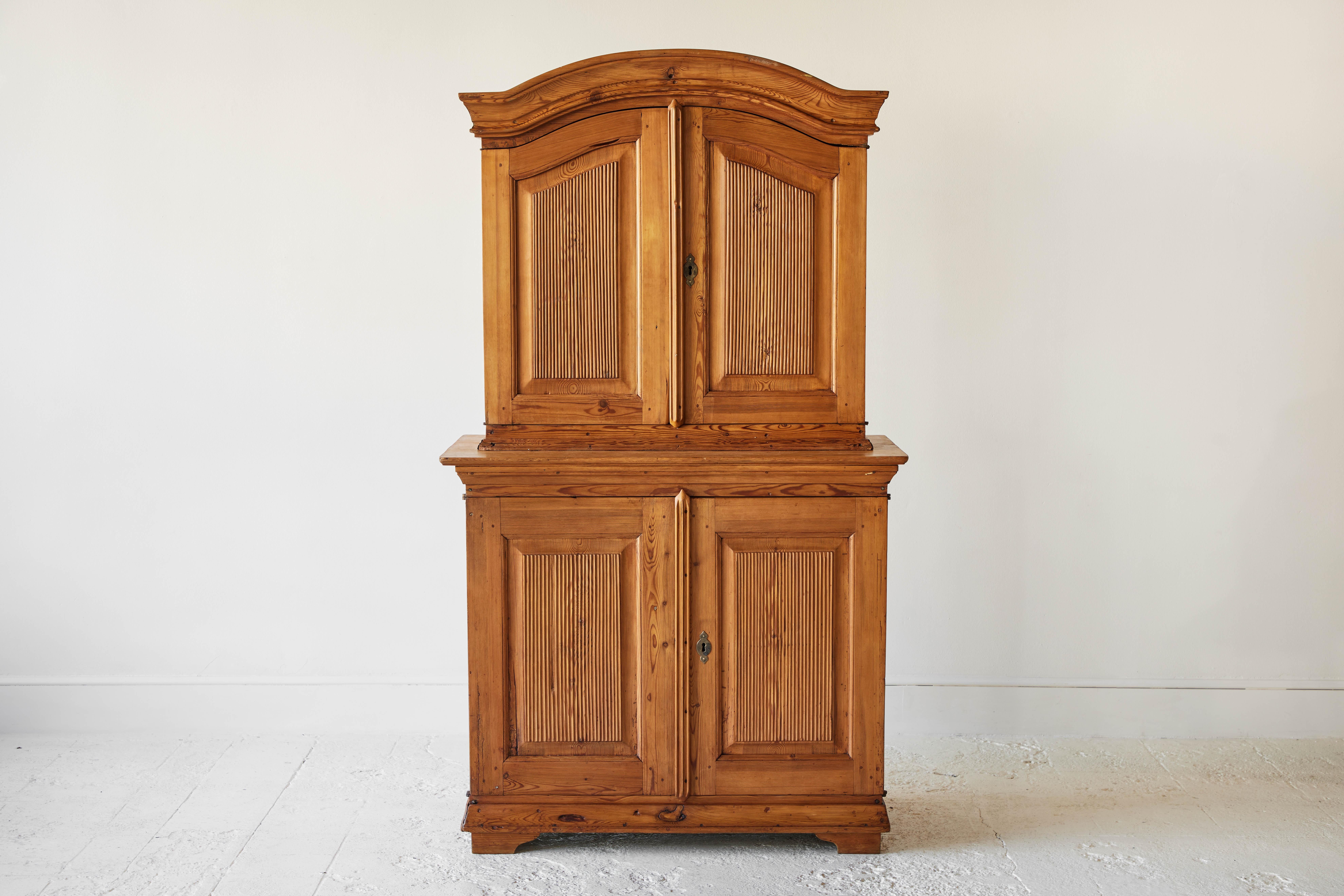 Swedish pine four door hutch with arched top. Interior is painted a rustic green.