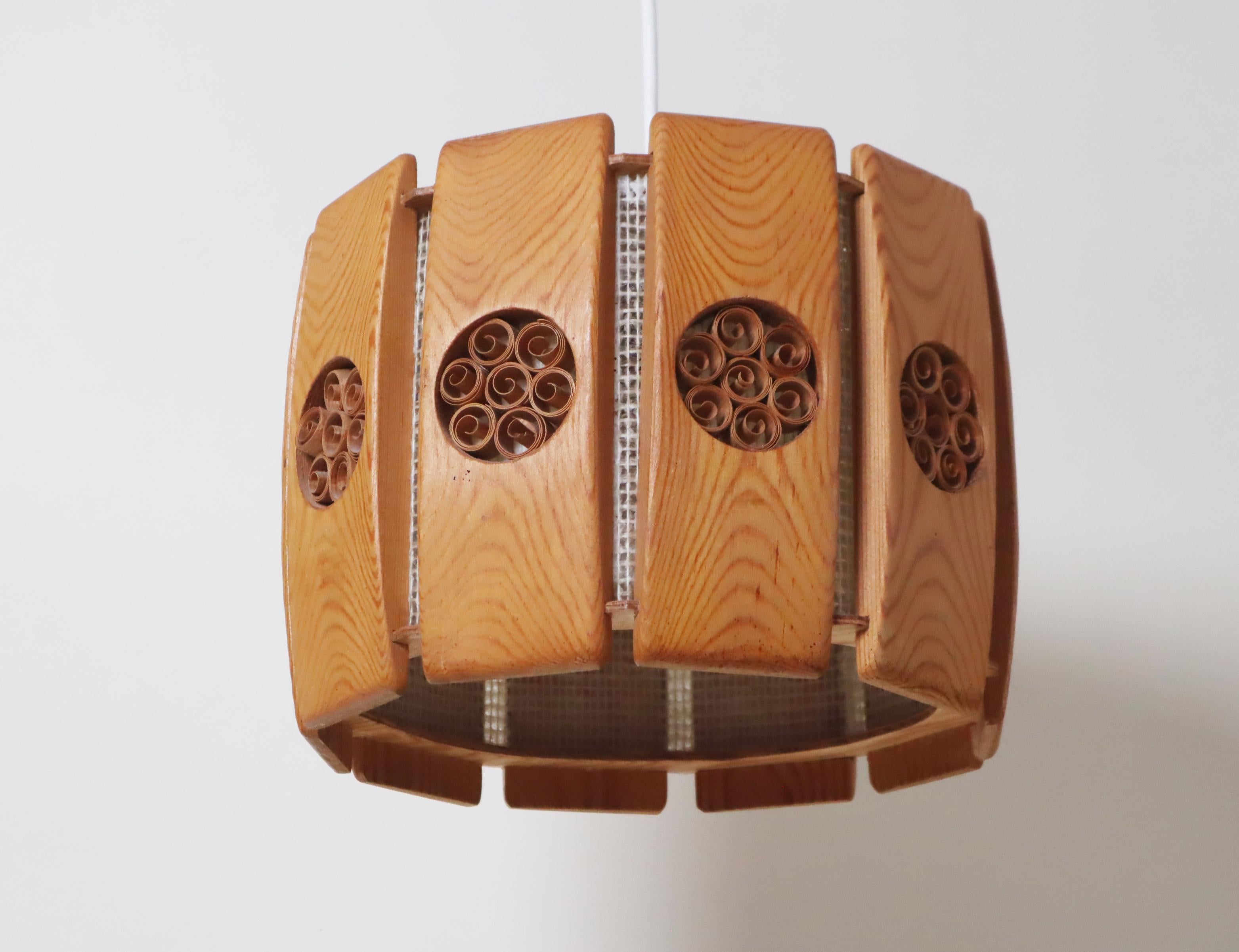 This lovely Swedish pendant lamp gives off a warm, inviting glow that's perfect for setting a cozy atmosphere. Its soft, soothing light will help you unwind and feel at ease. This Scandinavian lamp is timelessly simple, yet playful with its subtle