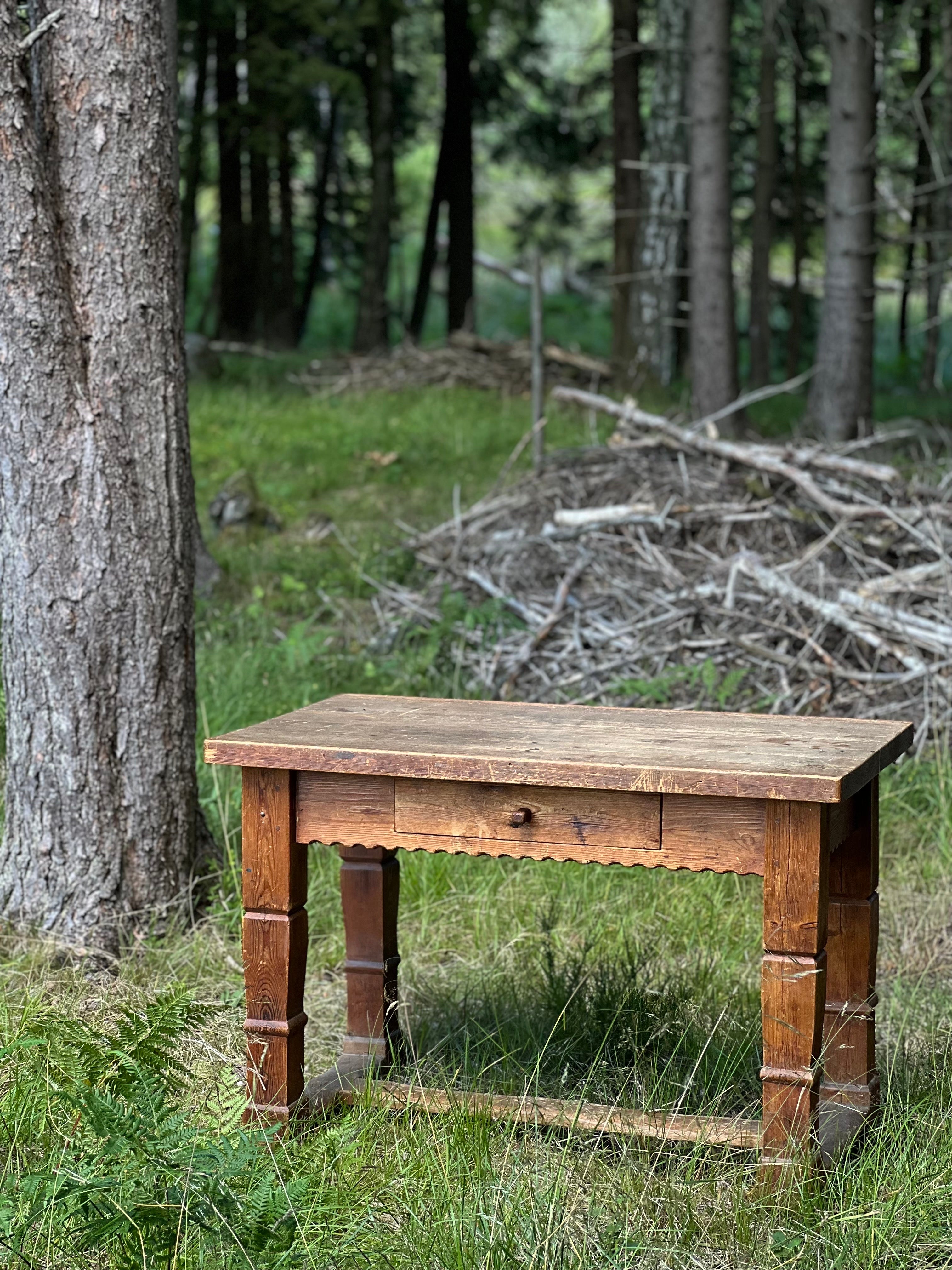 Unique Swedish hand crafted pine table/desk circa 1800. Lots of history, patina and traces of time. Very good condition. Could be use as a desk, console or a kitchen table. A true eye catcher. The details are so