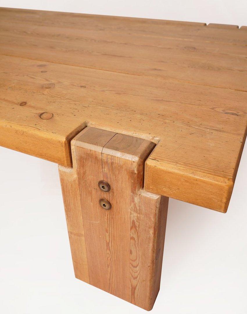 This Swedish pine wood low coffee table substantial in size, serves as a sturdy and heavy table.