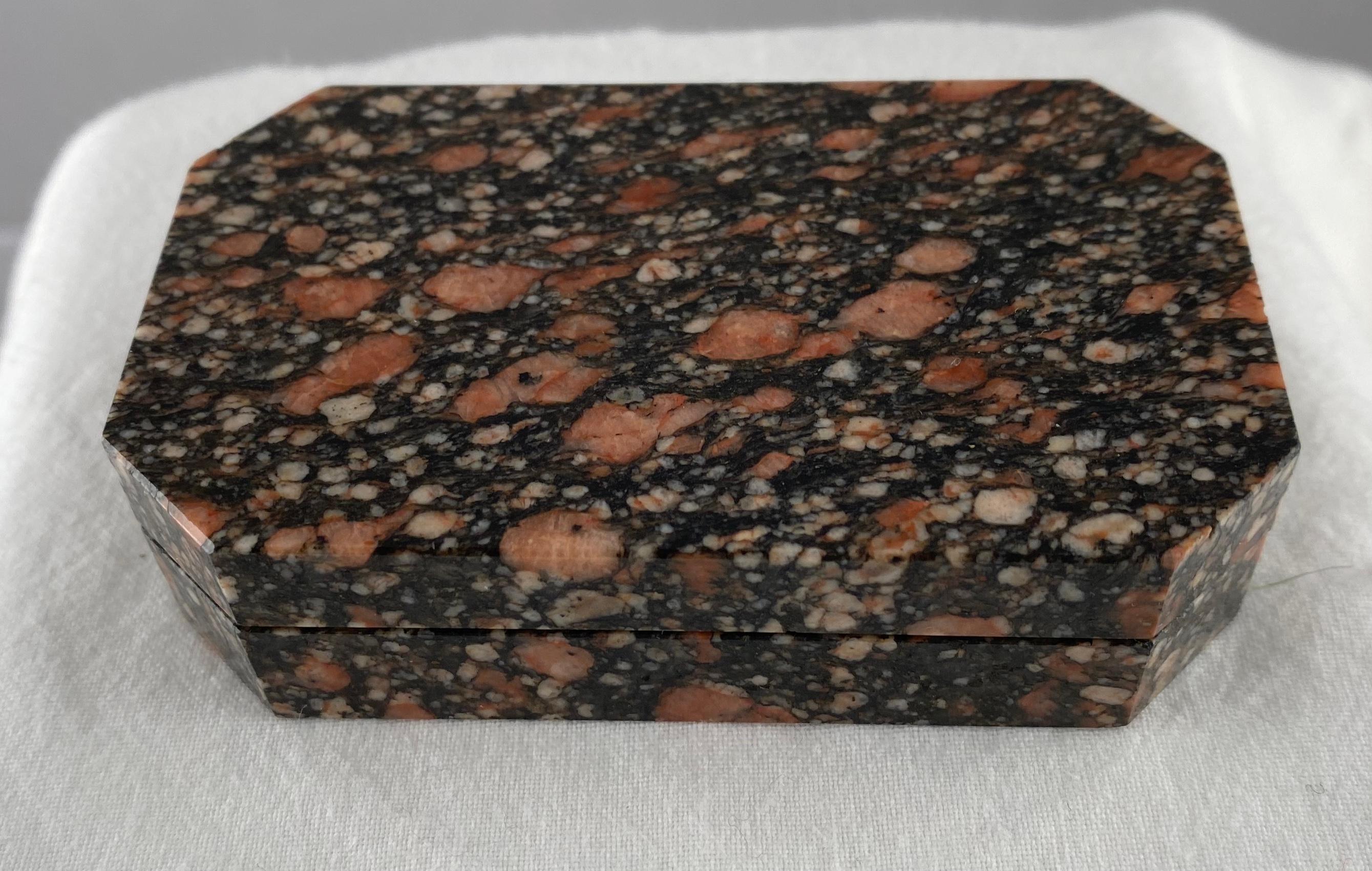 A small masterpiece. A rectangular box made of porphyry. Top design and quality. Alos a very unusual type of porphyry. 
The craftsmanship is spectacular.