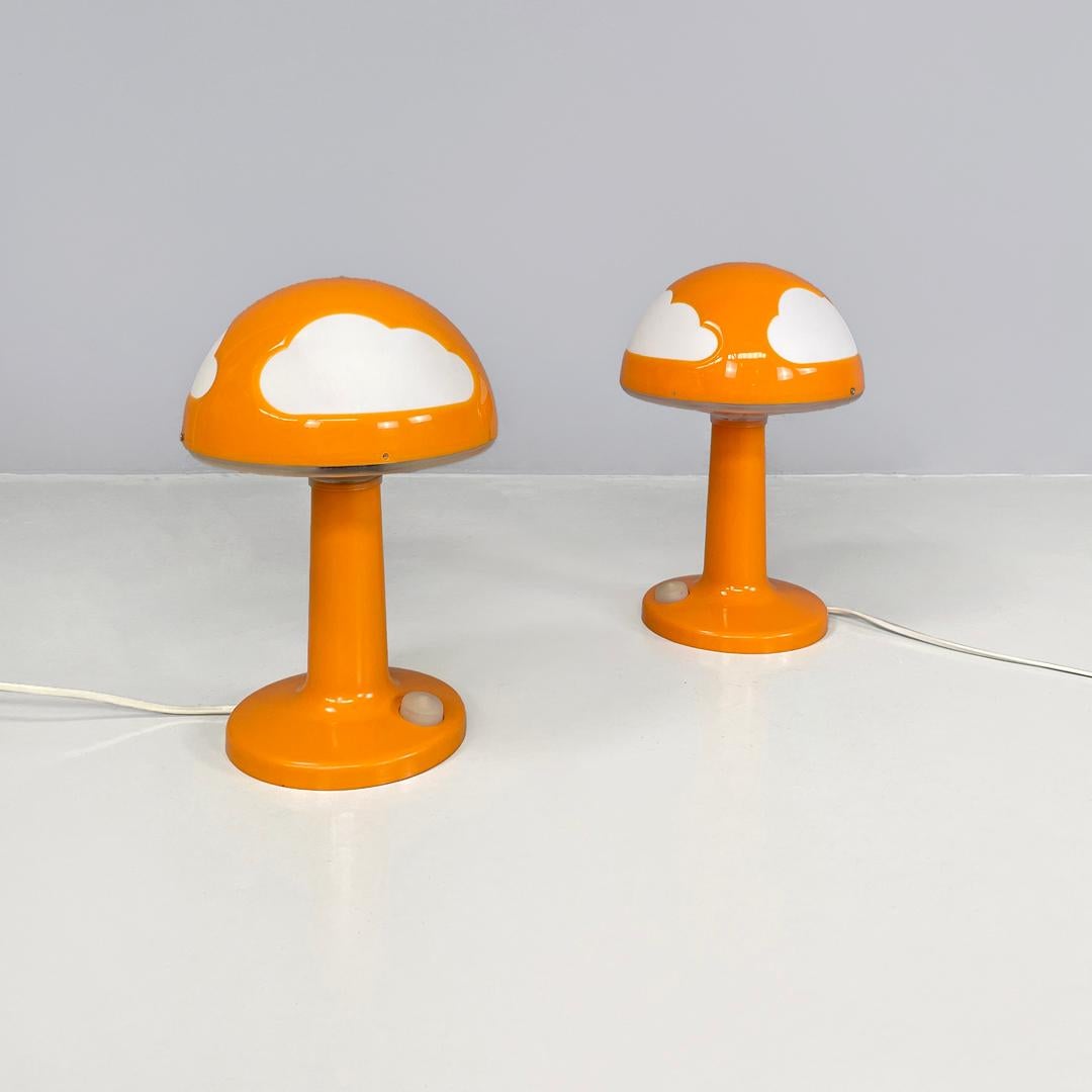 Swedish postmodern orange plastic table lamps by Henrik Preutz for Ikea, 2000s
Pair of table lamps mod. Skojig with round base in orange plastic. The structure resembles the shape of a mushroom, the domed lampshade features white cloud-shaped