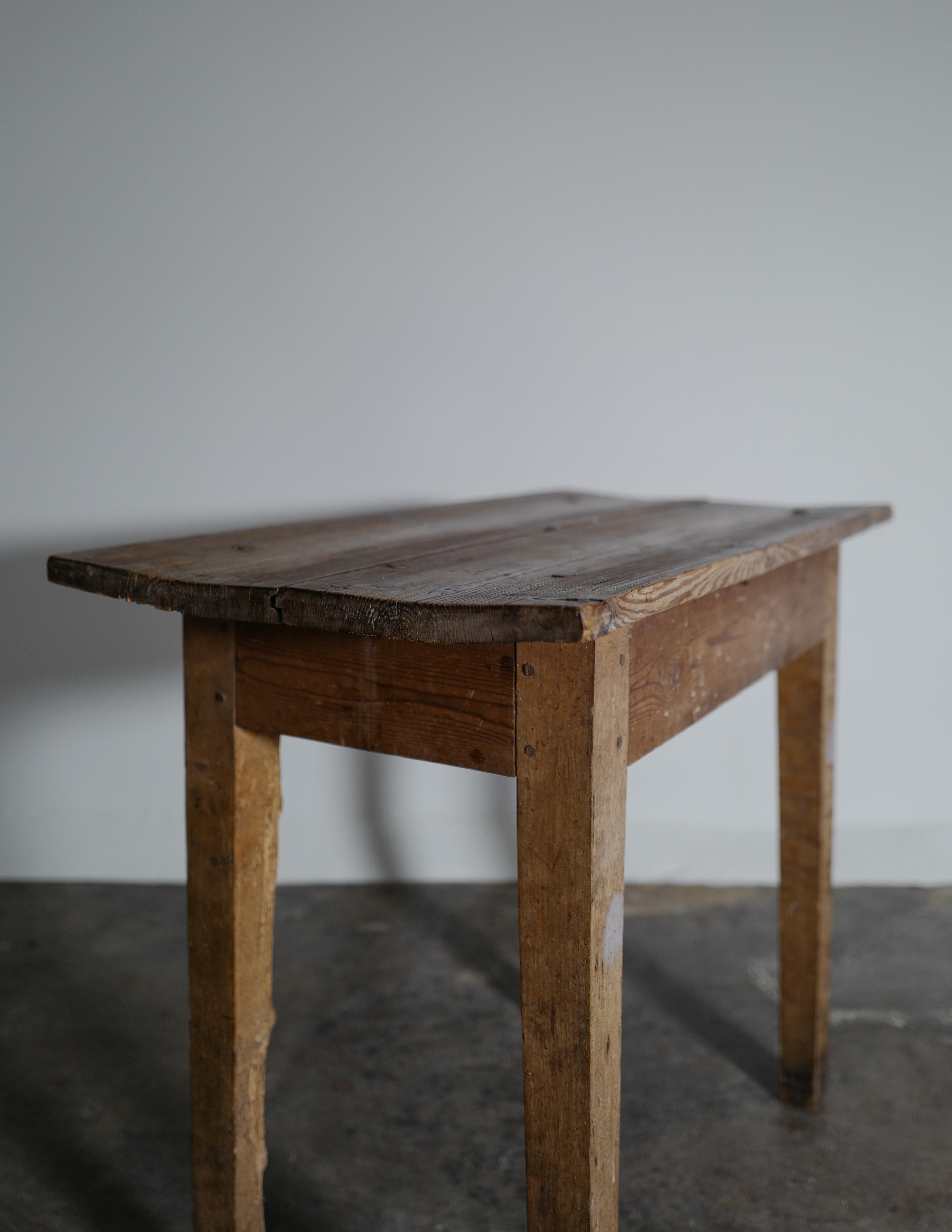 Rare console / side table in a primitive and antique style made in Sweden, late 1800s. In good vintage condition with lot of character, patina and feel from use over time. Stabile and rustic in its construction.