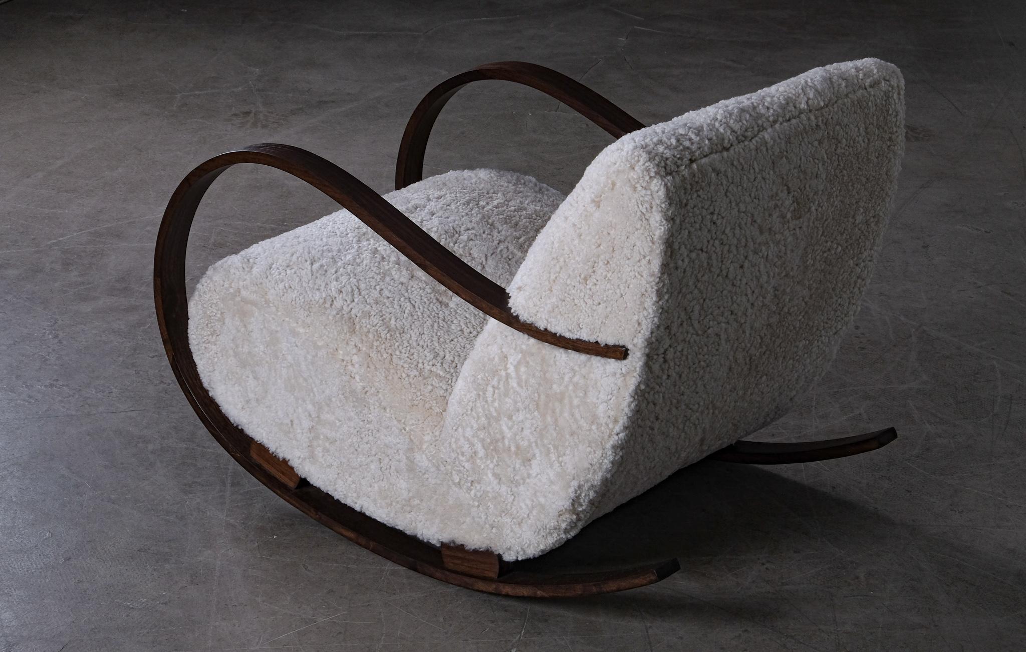 Reupholstered in nature colored sheepskin. Produced in Sweden, 1940s. 
Completely restored.

   