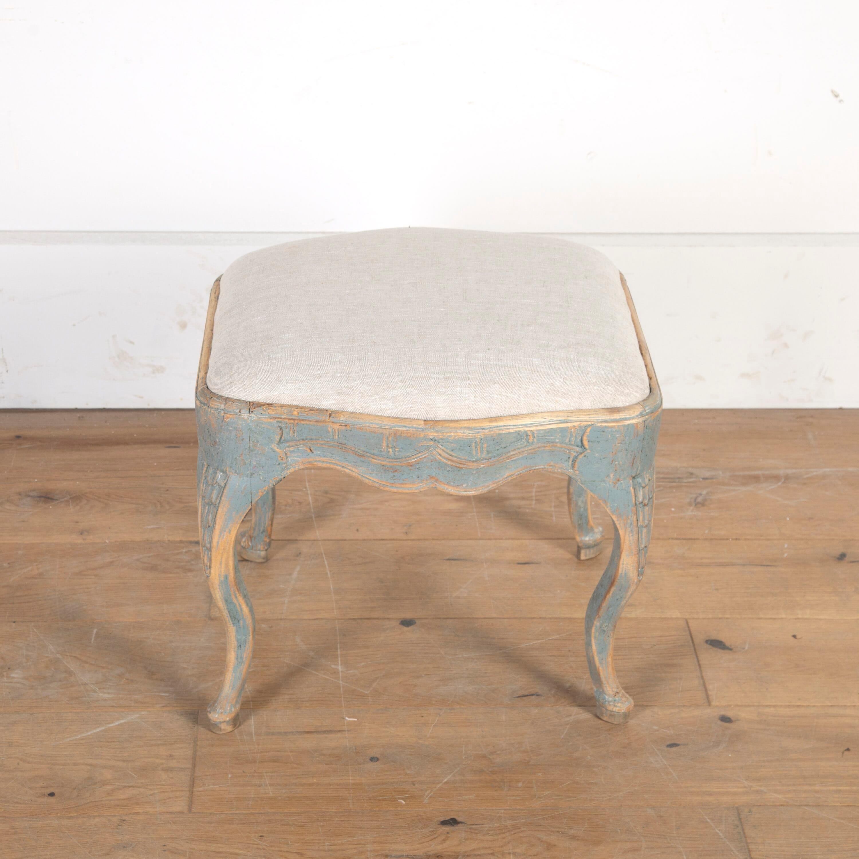 Wonderful Swedish 18th century Stockholm-made footstool.

This pine stool has wonderful rococo curves with a scalloped apron and carved cabriole legs. 

It has been repainted in blue and newly upholstered in linen. 

 