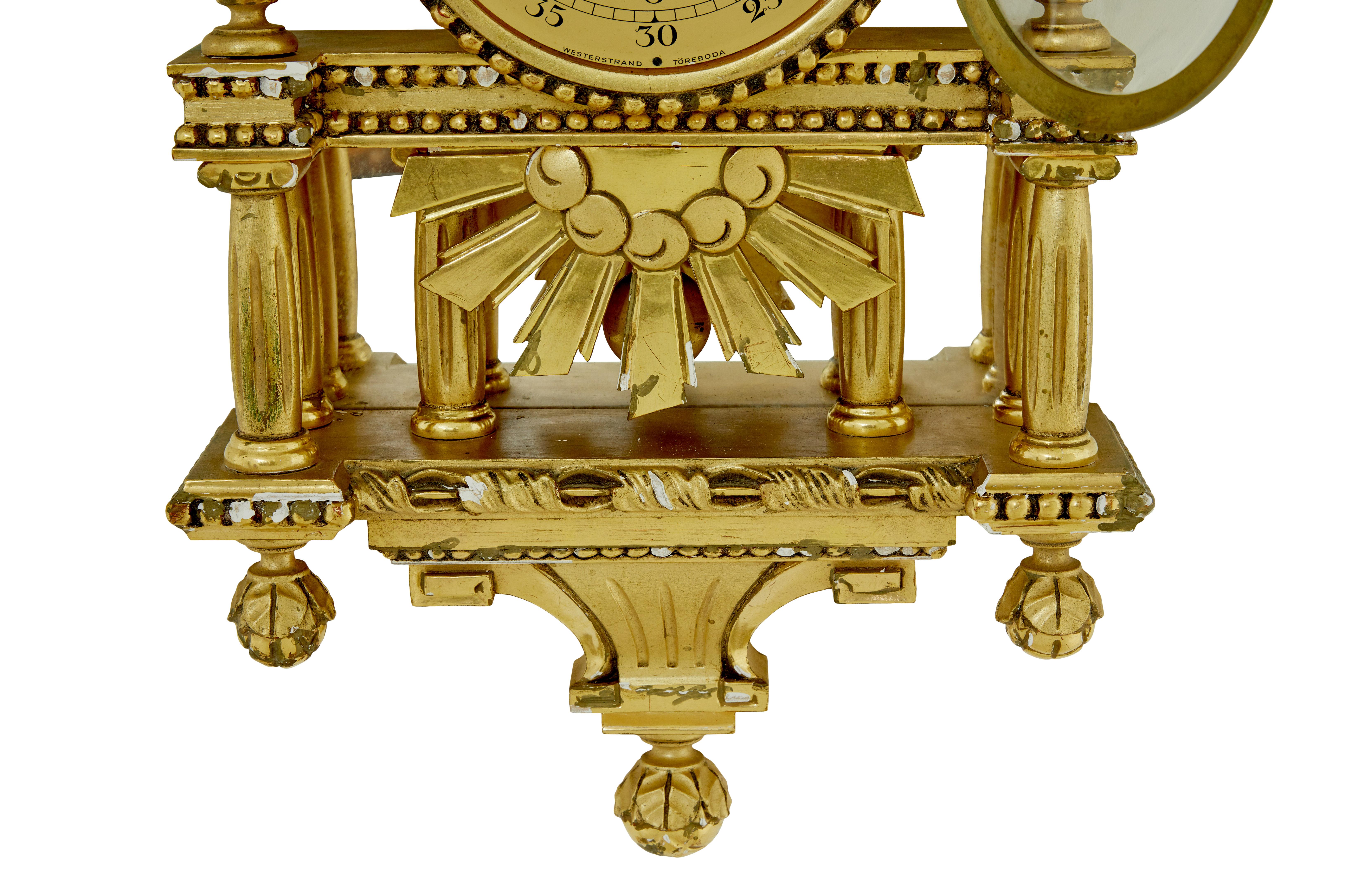 Carved Swedish rococo revival gilt wall clock by Westerstrand For Sale