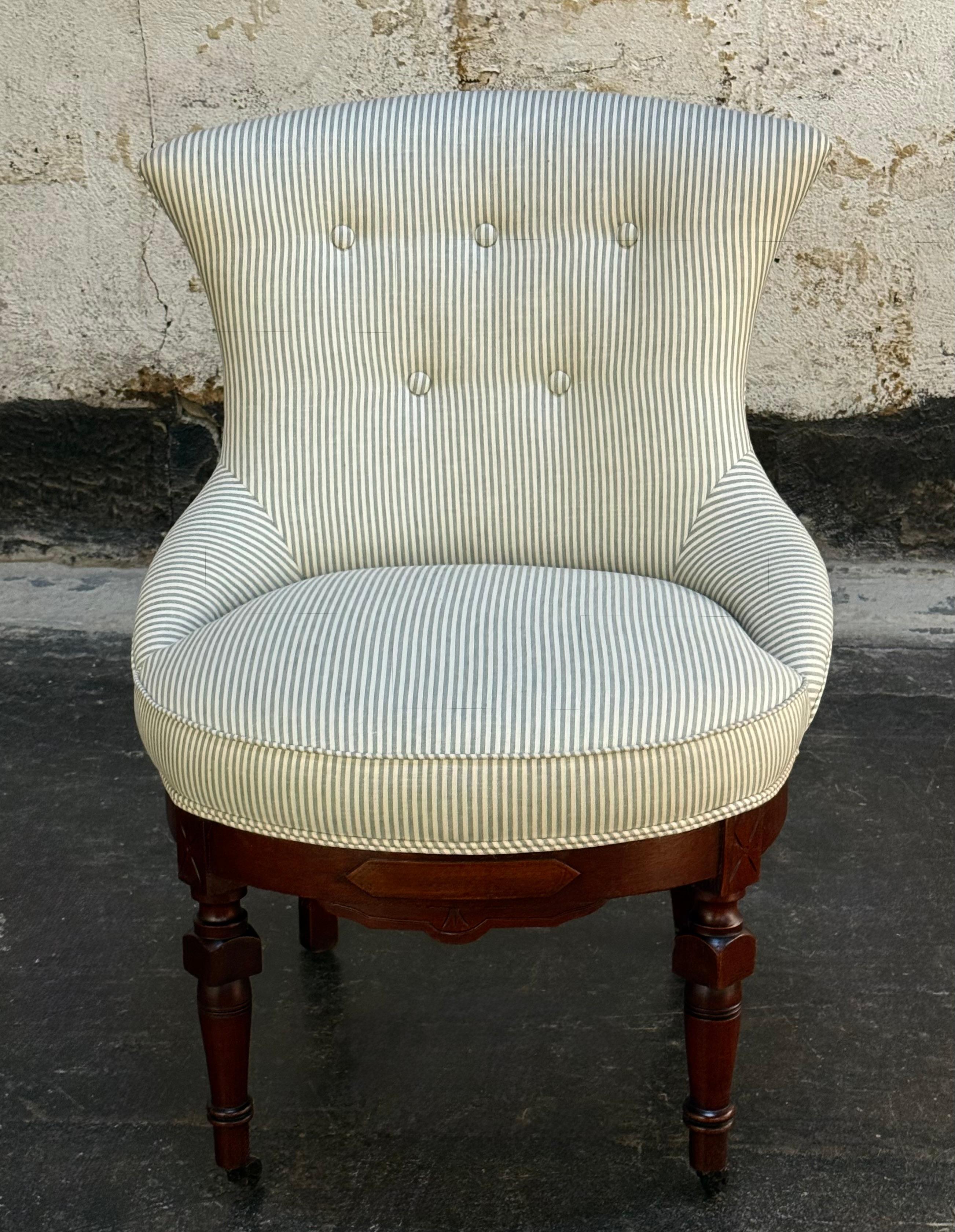 Fully restored antique Swedish Rococo “Emmastol” (Emma Chair), a classic piece of 19th-century Swedish furniture design in the Rococo Revival Style (Swedish counterpart to Victorian), now modernized with a crisp glazed linen stripe.

This sculptural