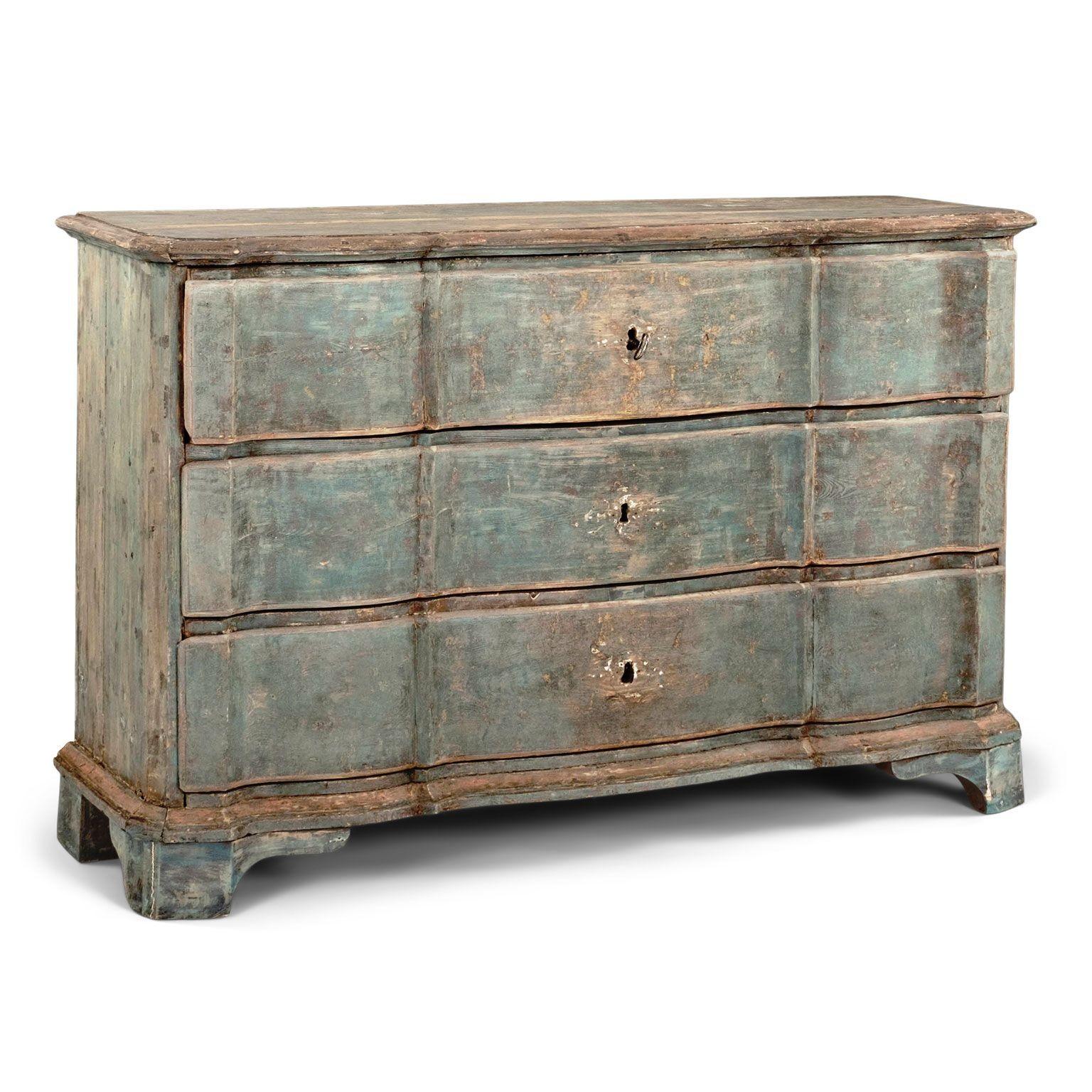 Swedish rococo serpentine block-front commode in original blue paint. Rococo period commode (circa 1760-1779). Hand carved in pine. Mortise and tenon joints. Original painted finish in blue with soft faded red detail. Original block feet. Three wide