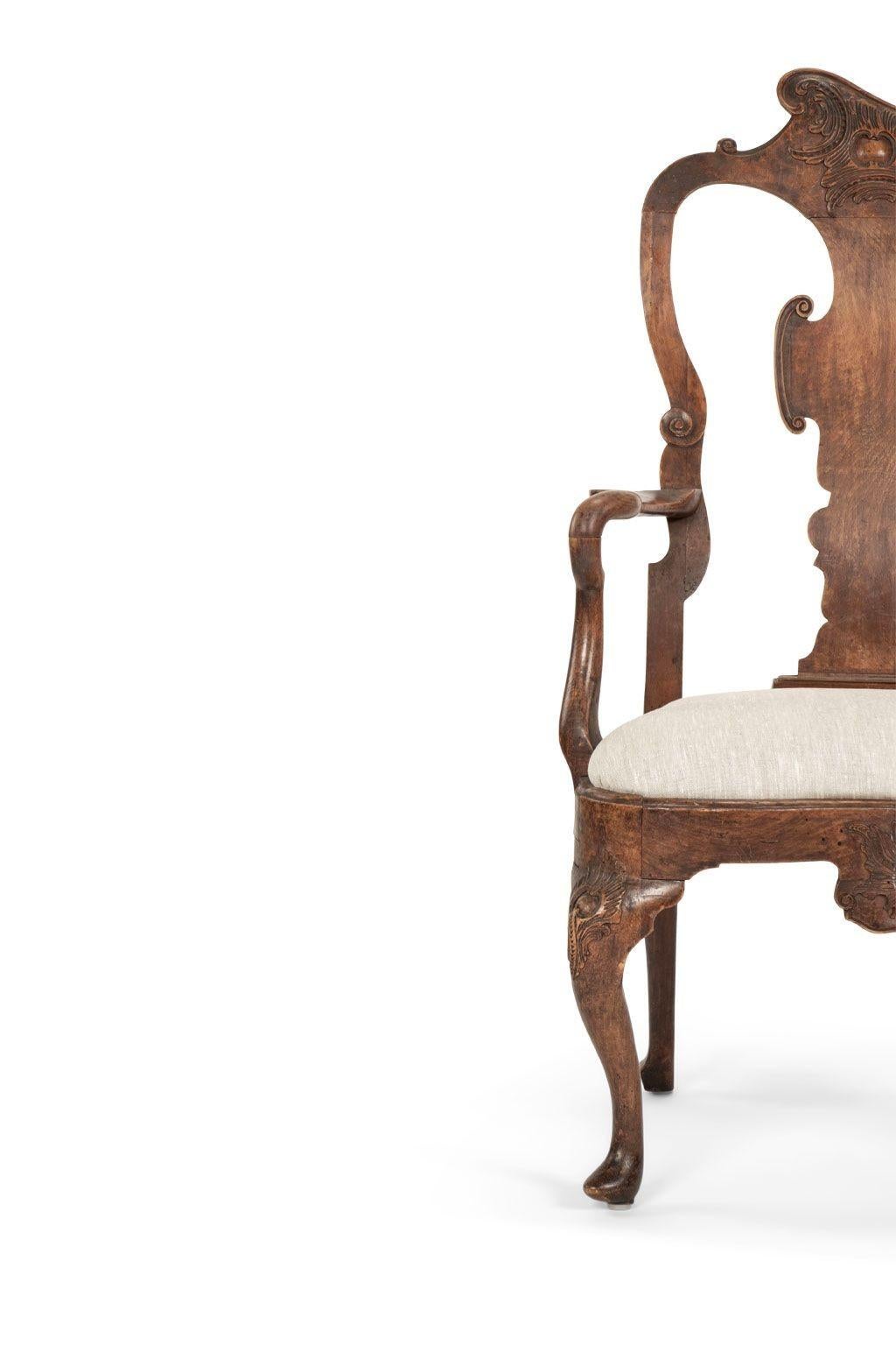 Swedish rococo walnut armchair circa 1740-1769. Finely hand-carved in a nice, large scale. Excellent condition. Stable, sold and sturdy. Mortise and tenon joints. Exquisite carved detail. Initialed 