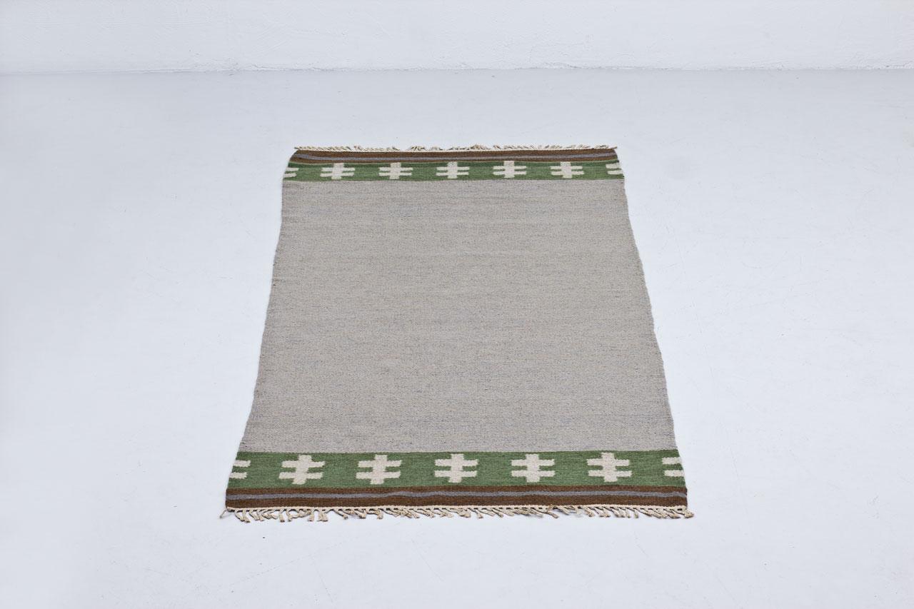 Swedish handwoven wool carpet
in “rölakan” flat weave technique
by unknown designer or maker.
Made sometime during the 1950s.

Length 238cm (excluding fringes).