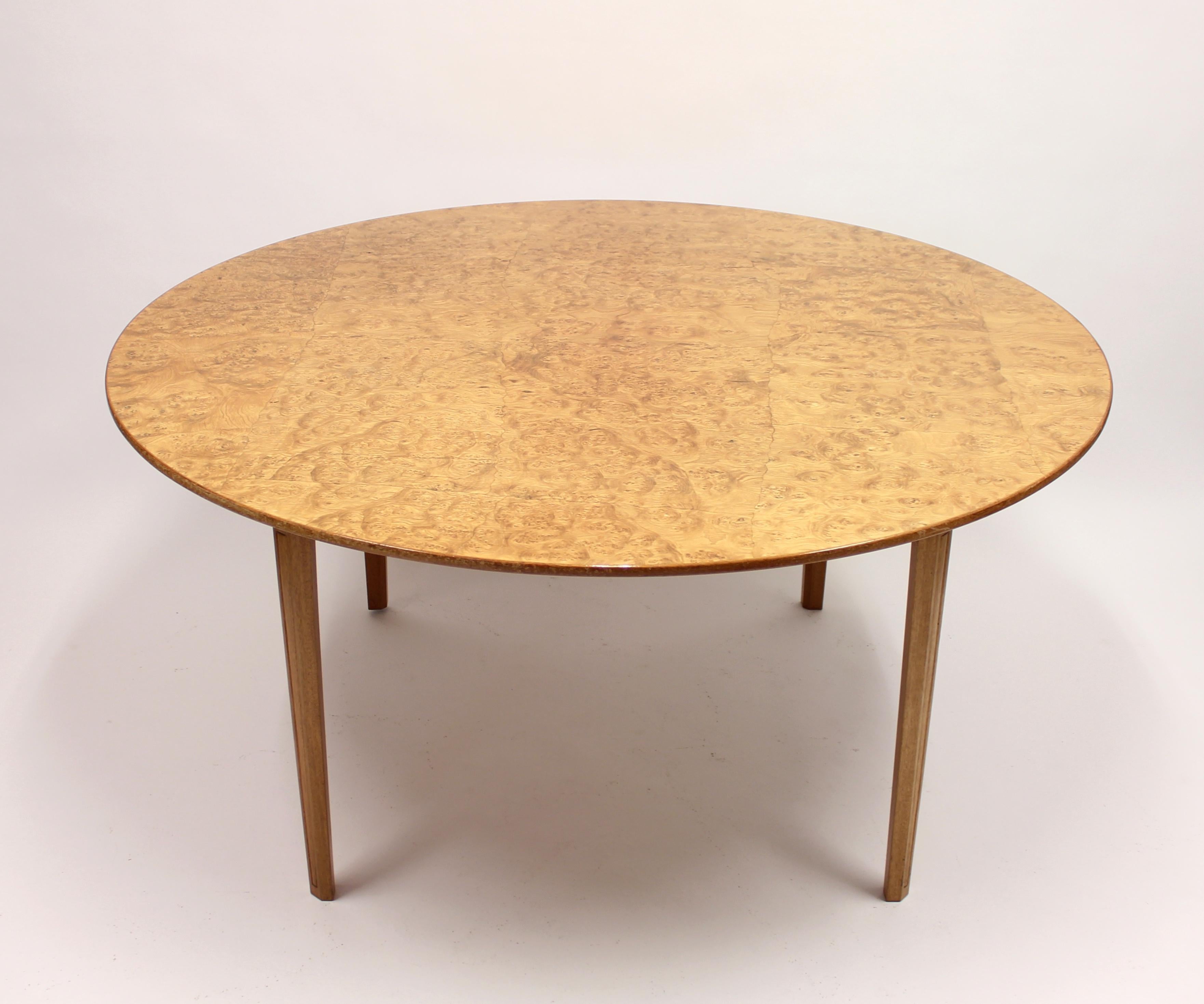 Unique one-of-a-kind high quality hand-crafted dining-/games table executed by unidentified master cabinetmaker, most likely a special order, Swedish, circa 1970s. Removable tabletop, held in place by four chocks, with alder root (or possibly birch