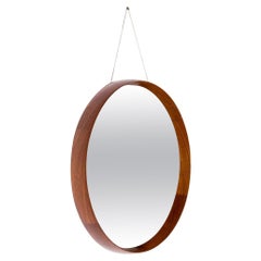 Swedish round wall mirror in Teak and Brass by Uno 
Östen Kristiansson/Luxus.