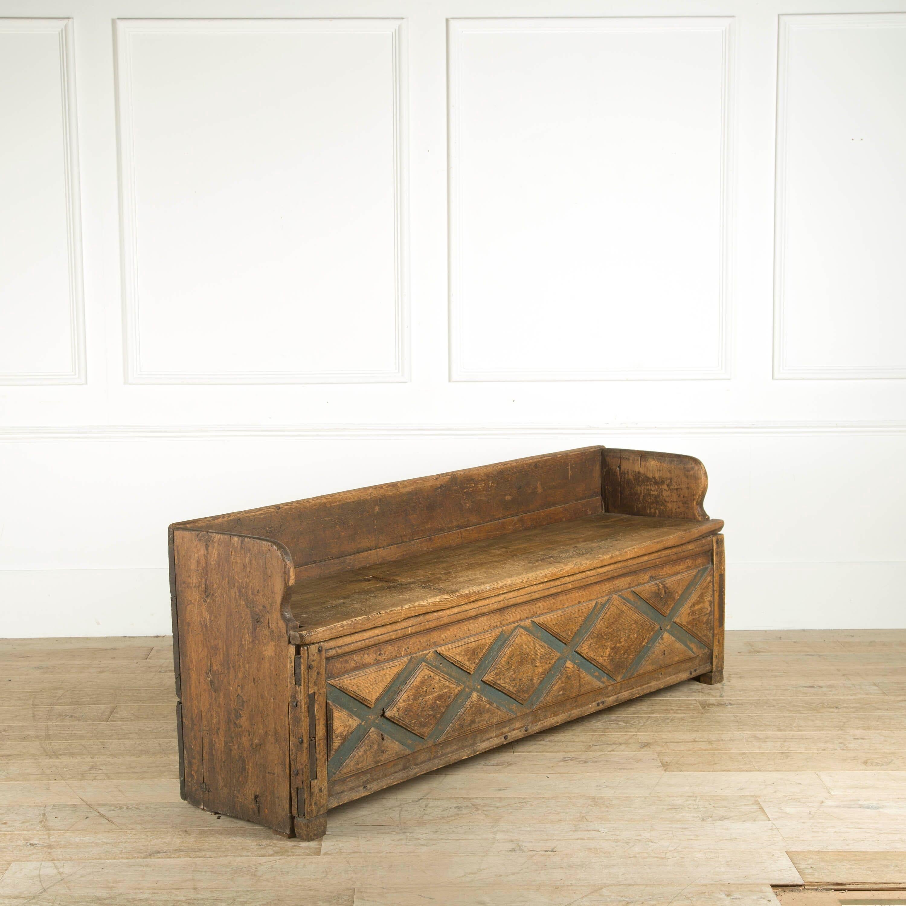 A rustic Folk Art bench (FÃ¥llbÃ_nk) from Dalarna. The FÃ¥llbÃ_nk or bench has a foldable seat and offers plenty of storage underneath.