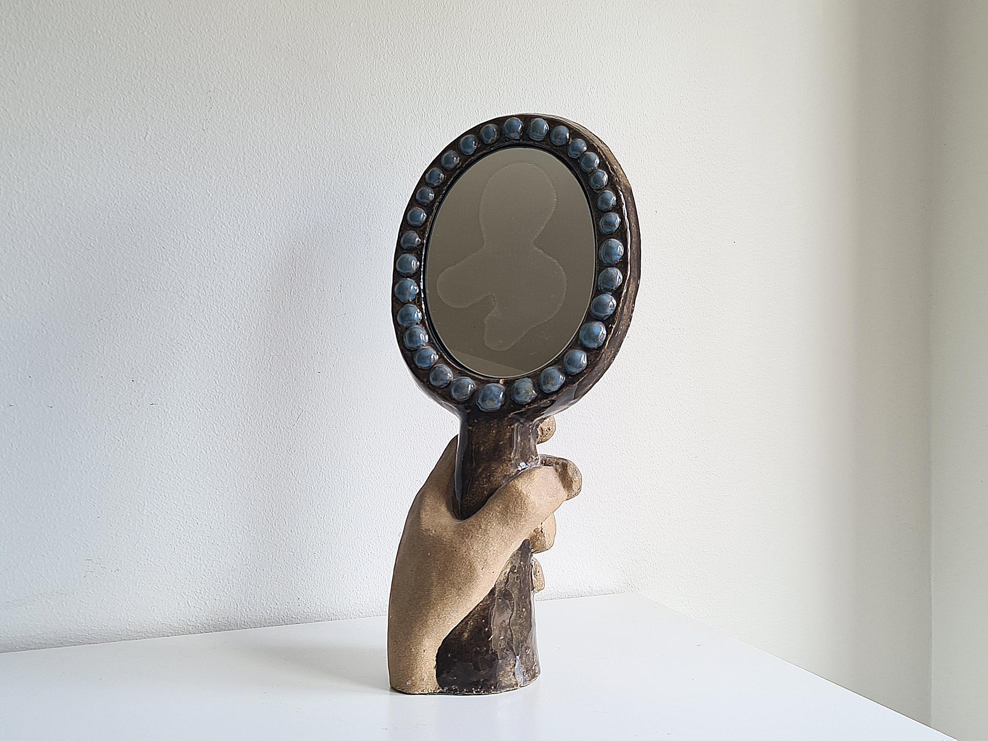 Cool and rare sculpture/mirror, possibly unique by Stig Carlsson.
Stig Carlsson was a swedish sculptor/designer. During his early career he was an apprentice to Gunnar Nylund at Rörstrand. In the mid 70's he opened up his own studio, Nyhamnsläge,