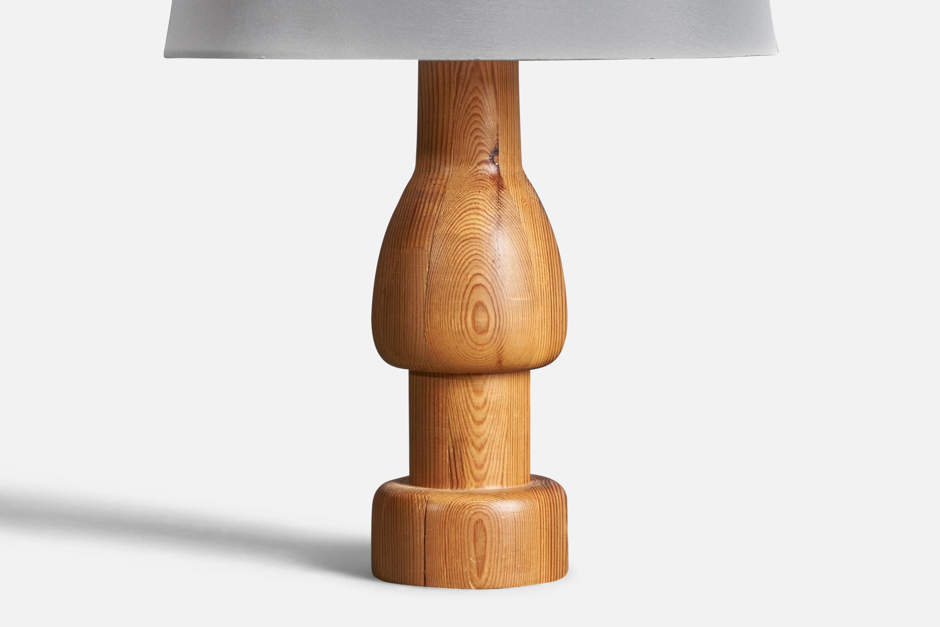 A sculptural table lamp. Designed and produced in Sweden, 1970s. Features solid turned pine. Has retained light patina over time.

Condition: Good

Wear consistent with age and use.

Dimensions of Lamp (inches):11” H x 3.25” Diameter

Dimensions of
