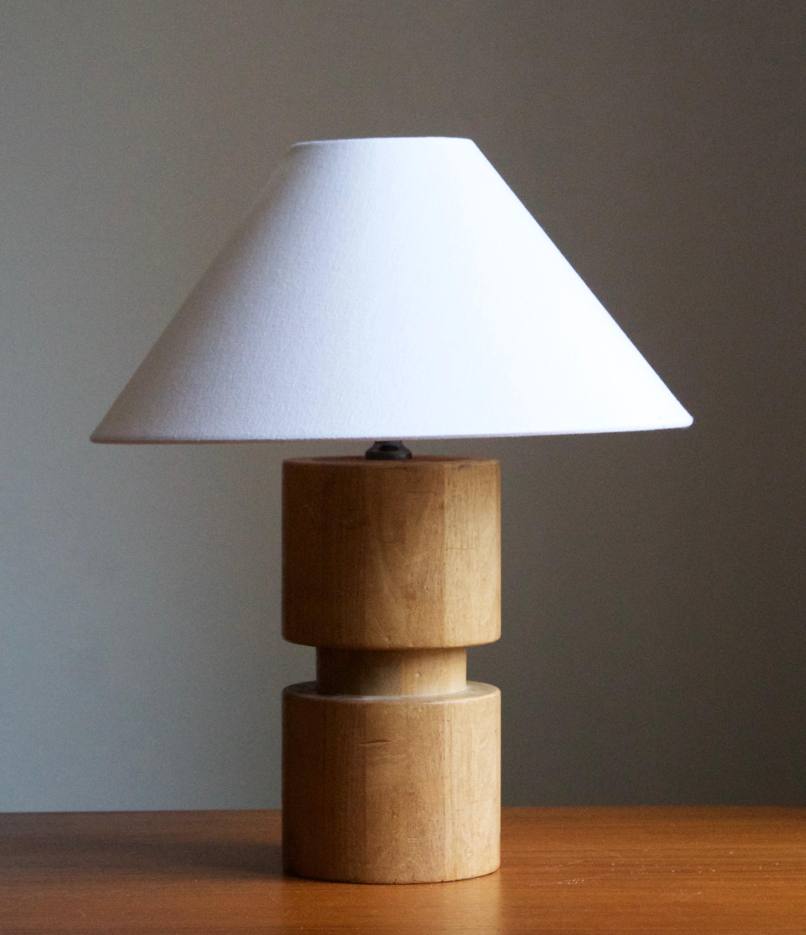 A sculptural table lamp. Lamp mounted atop of wooden architectural element, Sweden, c. 1940s.

Stated dimensions exclude lampshade. Height includes socket. The lampshade is not included in the purchase.