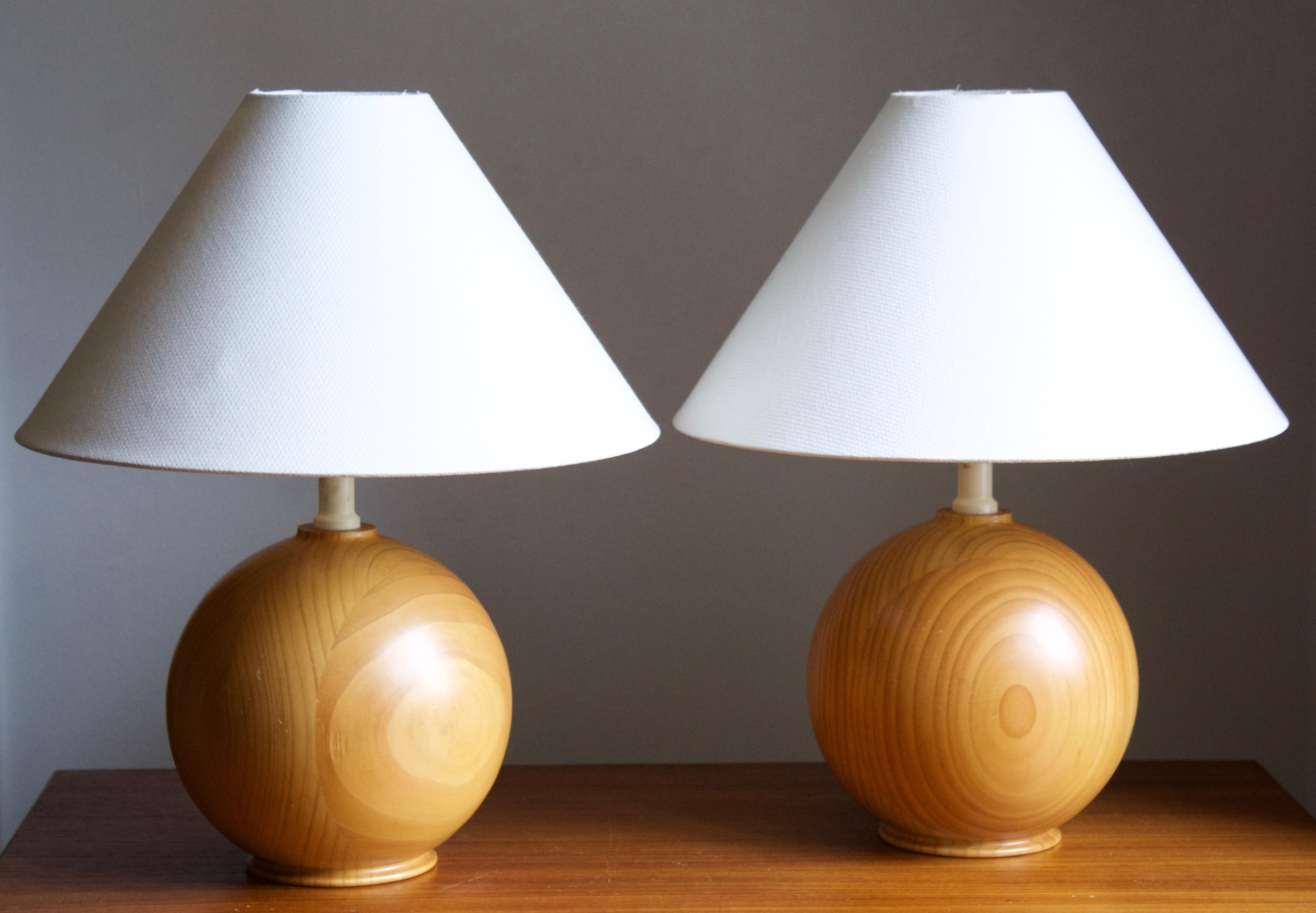 A pair of table lamps. Bases in solid pine. 

Stated dimensions exclude lampshade, height includes socket. Sold without lampshades.