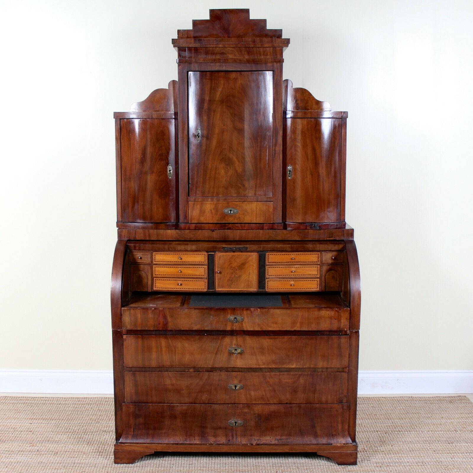 A rare and impressive large 19th century Swedish flamed mahogany secretaire in the Biedermeier manner.
The upper section with a three concave and convex shaped doors enclosed shelving and drawers.
The lower section fall flap enclosed a fitted