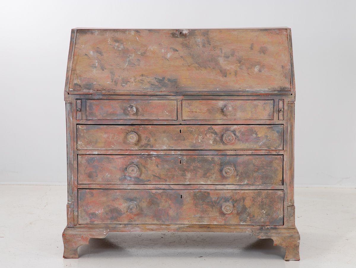A late 19th century Swedish secretary bureau with a drop front writing surface. Two over three drawers sits atop ogee bracket feet. Later paint.