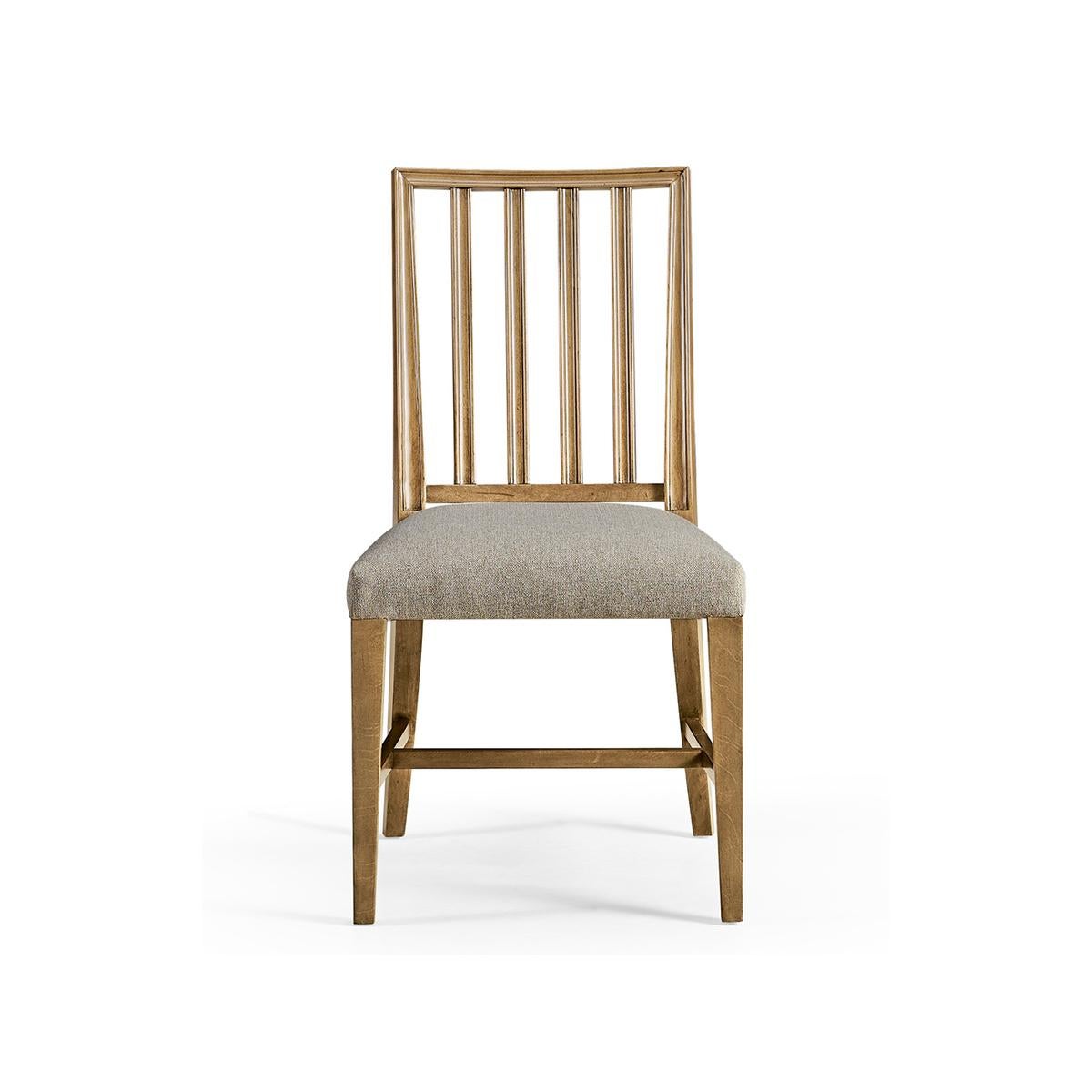 Swedish side chair in our sun bleached cherry finish, with pristine forms and clean lines capable of dressing a dining space up or down with ease. With a molded slat back and a delightfully plush cushion upholstered in a creamy oatmeal performance