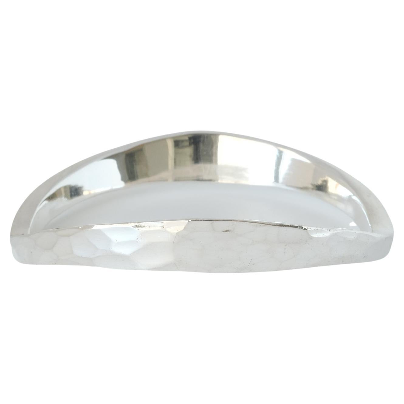 This sterling silver bangle has a beautiful hammered surface. Its shape is slightly arched, making the bangle fall incredibly nice on the wrist.

This bangle will fit well in both an everyday environment as well as in a more festive one. This is