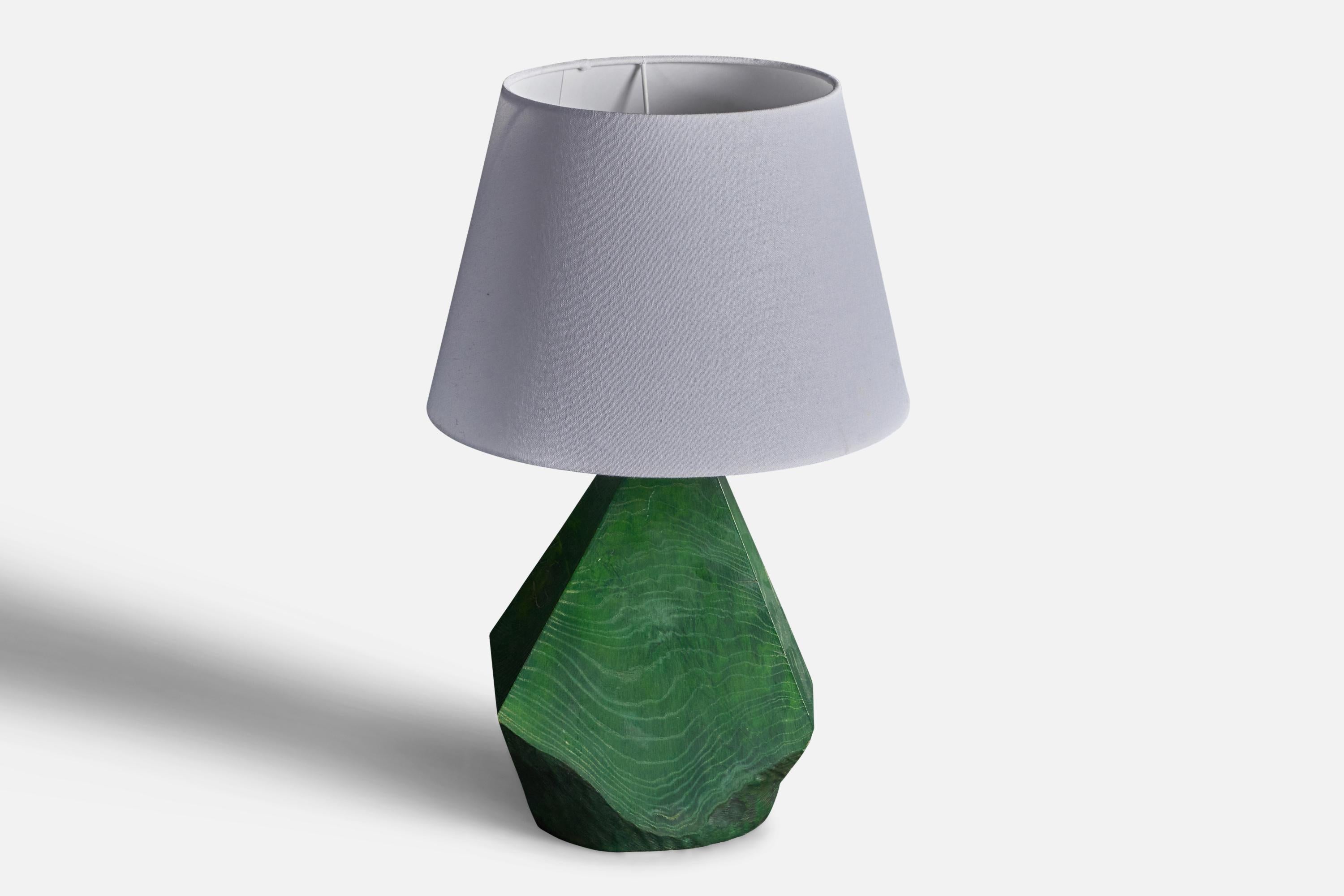 A sizable free-form table lamp, green painted solid wood. Produced c. 1950s-1960s. Unknown studio designer. 

Sold without lampshade. Stated dimensions exclude lampshade, height includes socket.
  