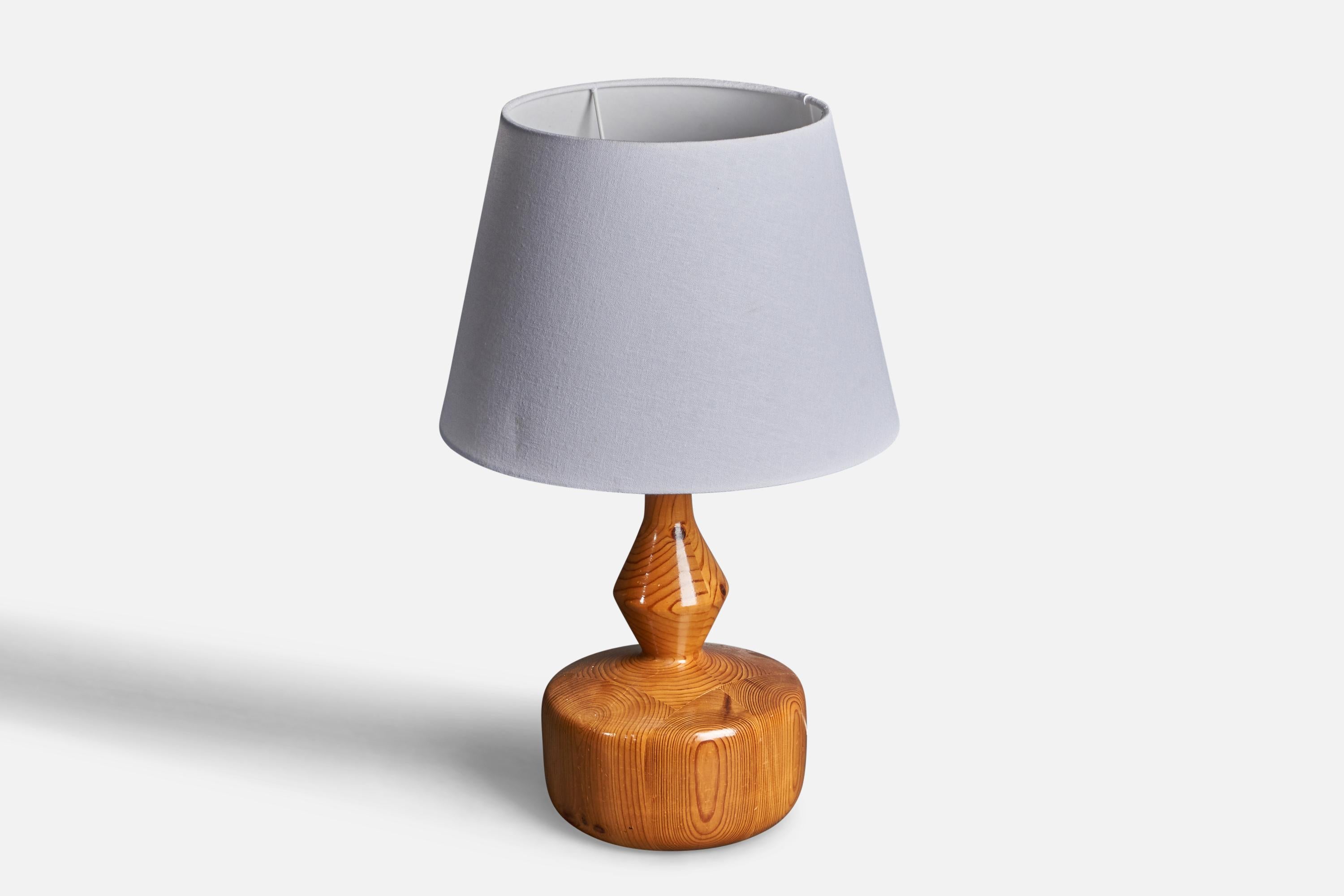 A table lamp designed and produced in Sweden, 1970s. In solid pine. 

Stated dimensions exclude lampshade. Height includes socket. Sold without lampshade.

Stated dimensions exlude lampshade, height includes socket. Upon request a vintage rattan