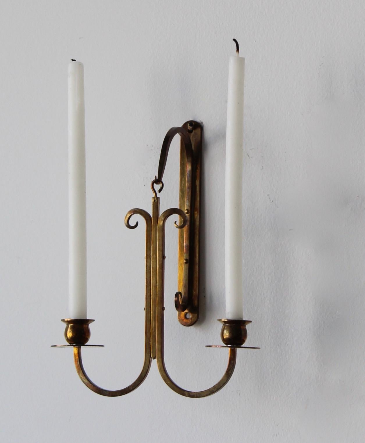Swedish, a set of wall candleholders / candle sconces, Brass, Sweden, 1940s.
 
  