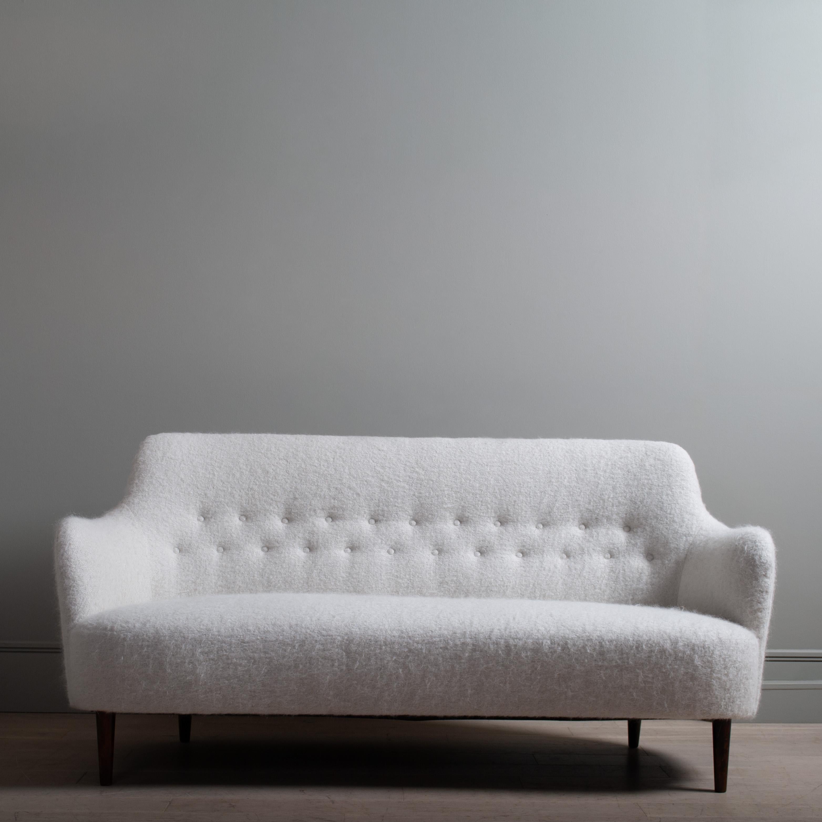 An original 1960s Samsas sofa by renowned Swedish designer Carl Malmsten for OH Sjogren. This sofa has been completely refurbished, reupholstered with new foam and covered in luxurious Pierre Frey Yeti fabric. Absolutely beautiful.
Contact us for