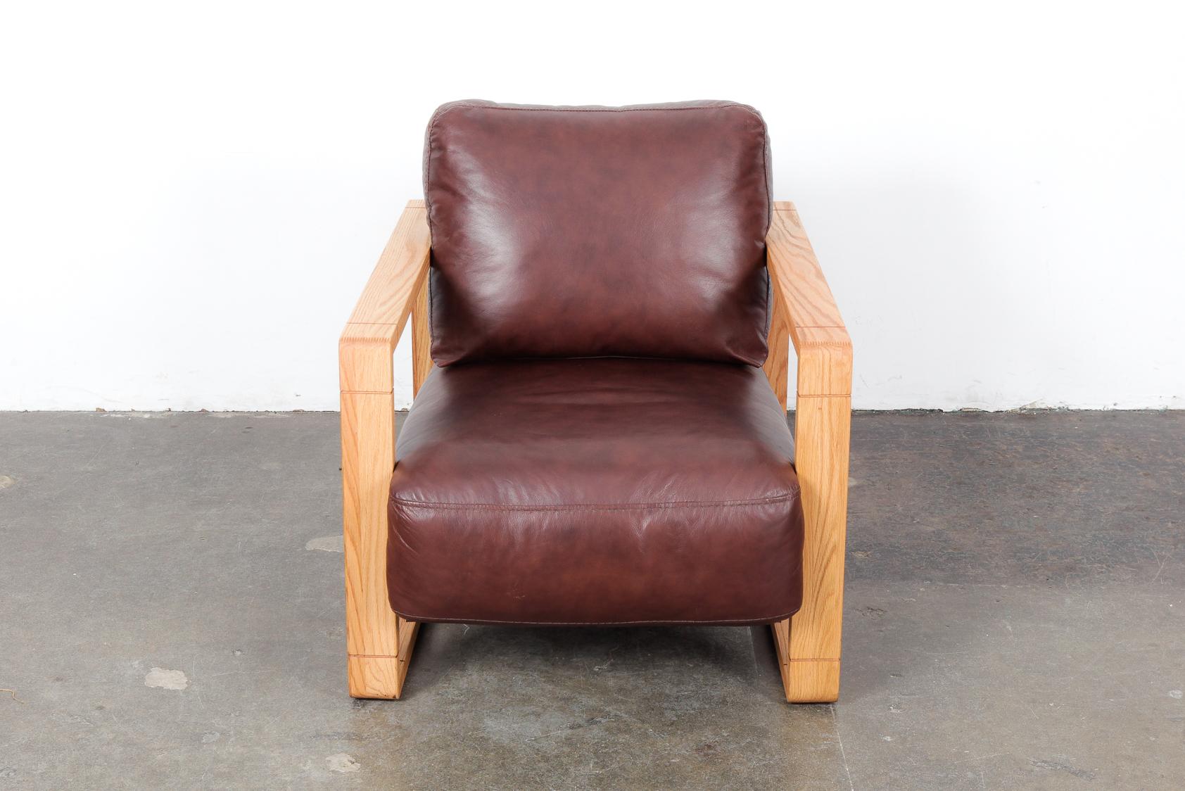 Swedish solid oak framed lounge chair with original chocolate brown leather. Newly refinished oak frame in a natural wax finish. Original leather is in very good condition. Box style sides and back, very clean lines coupled with the rich leather.