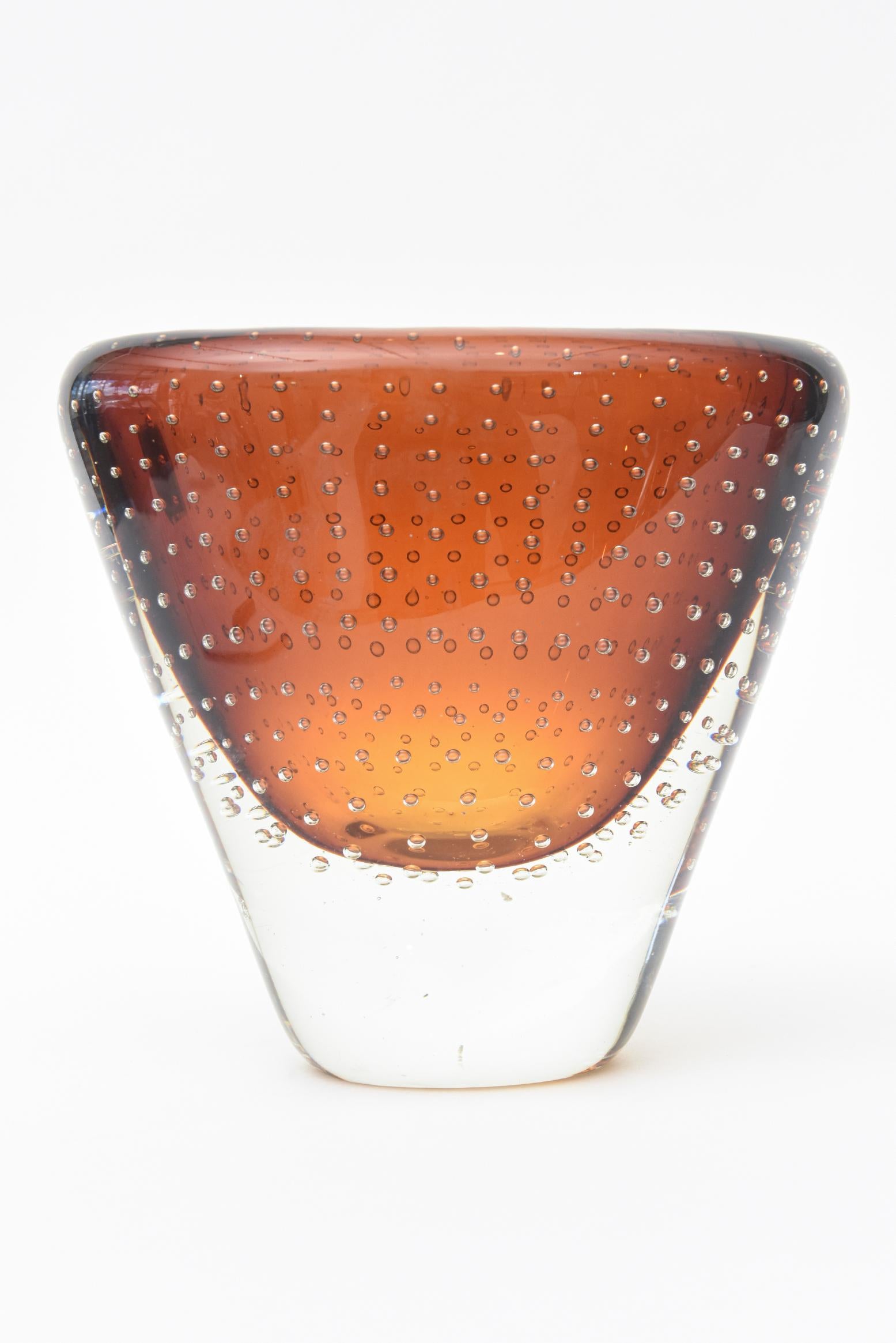 This lovely thick walled Swedish Sommerso glass vase has abundance of controlled bubbles floating called Bullecante. It is from the 1970s. The amber cognac color is rich looking and will transition from contemporary, to midcentury to transitional