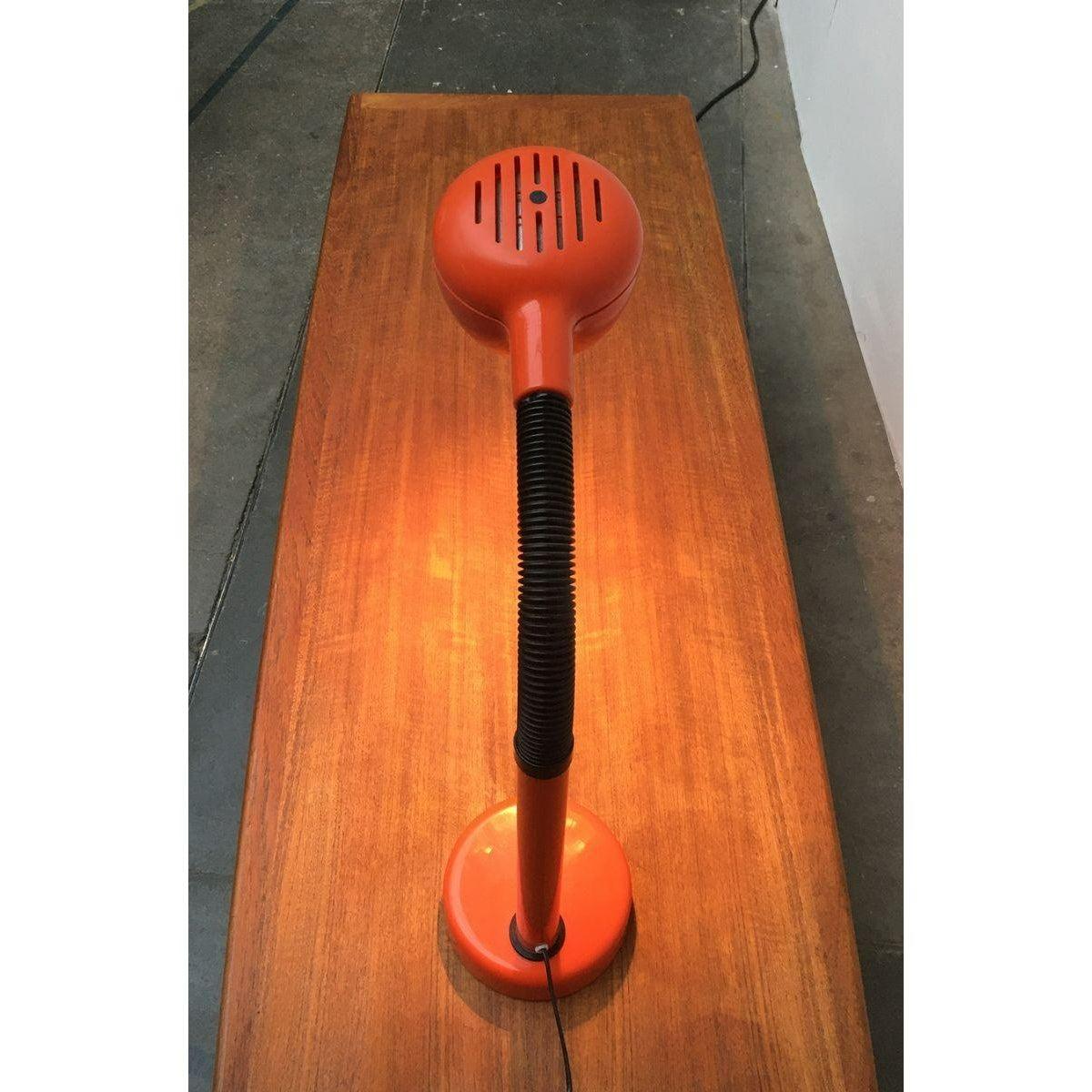 Space Age table lamp from the Swedish manufacturer Fagerhults from the 70s.

The lamp head is movable about the flexible central part of the lamp. Particularly striking is the contrast between the black hose element drops of colored light body with
