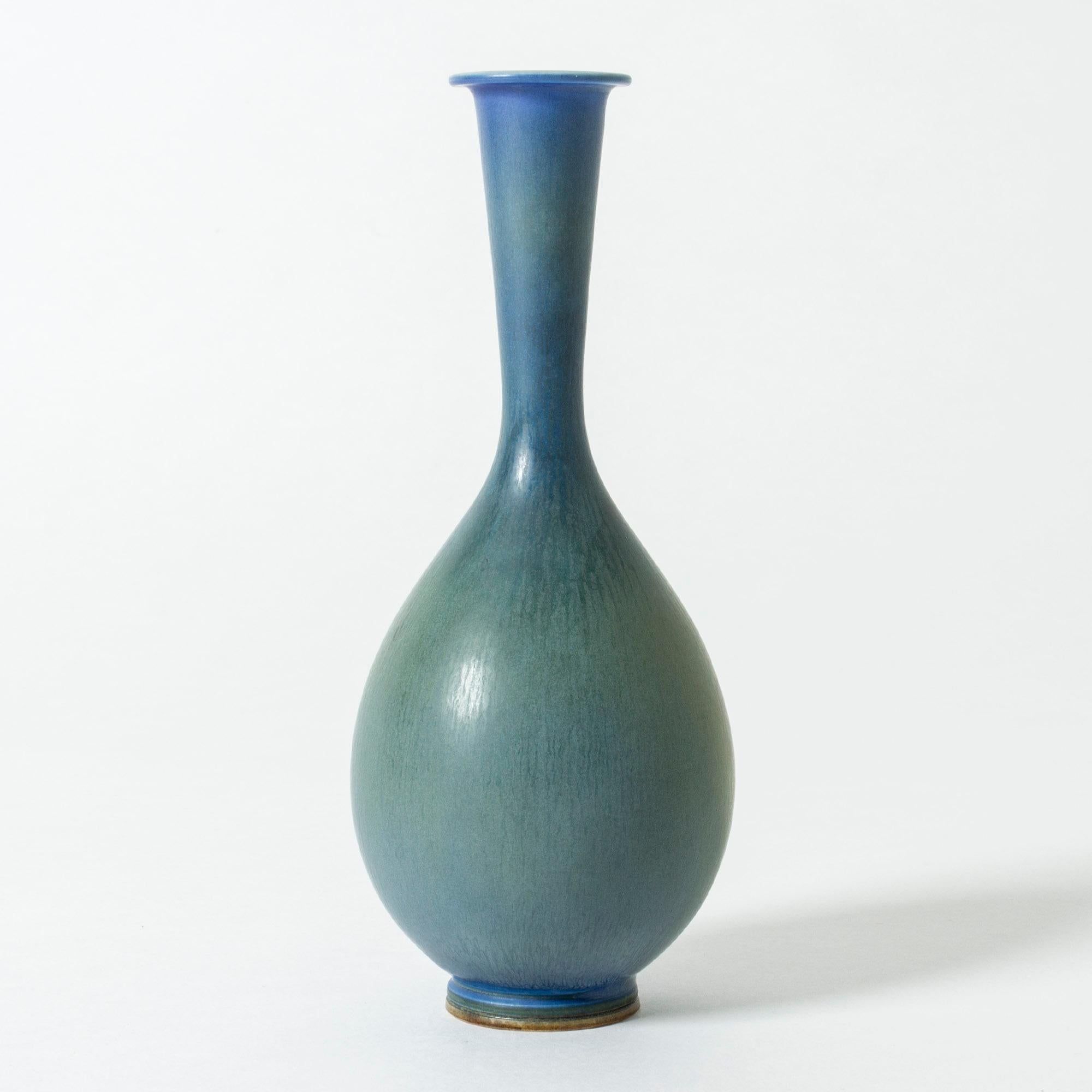 Beautiful stoneware vase by Berndt Friberg in a smooth, Classic shape. Blue hare’s fur glaze blends with green, making a striking effect.