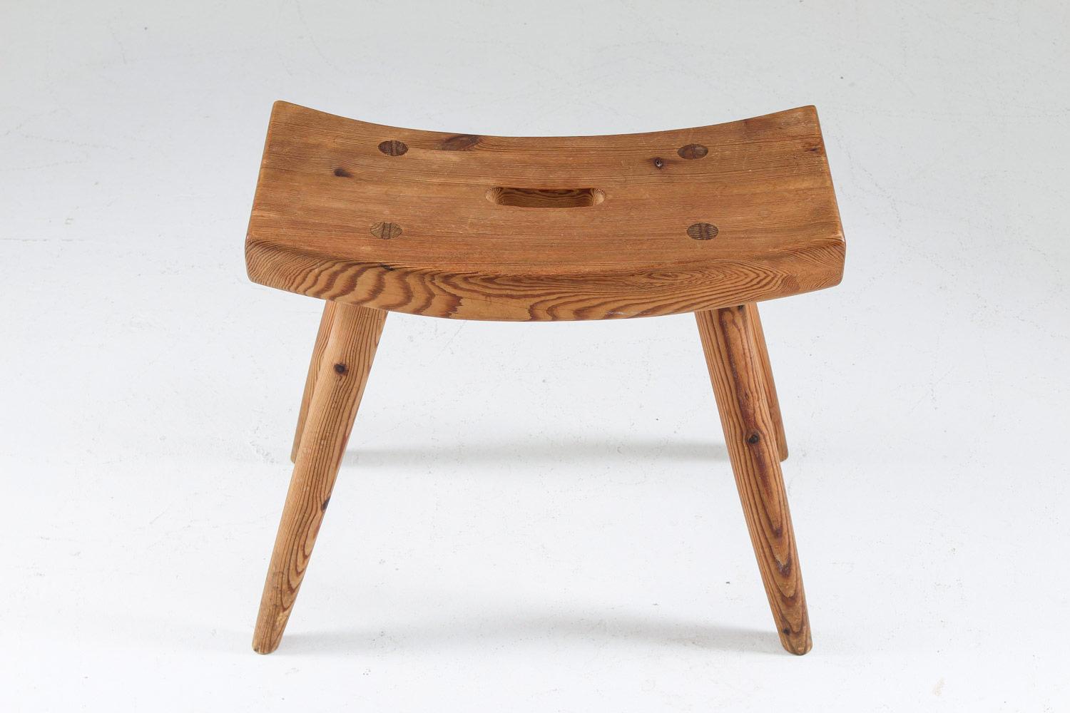 A stool in pine produced in Sweden, 1940s.
A great example of the sports cabin furniture that was produced in Sweden between 1930-1960. This anonymous stool is made of solid pine with beautiful shapes and details.
Condition: Very good original