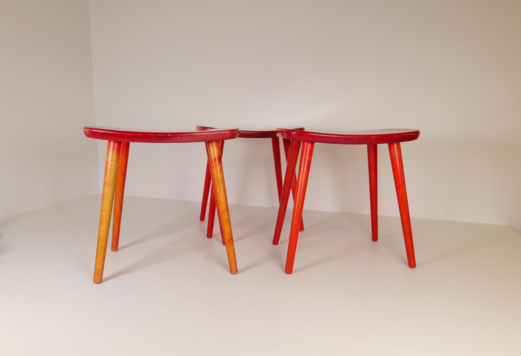 Birch stools in lacquered stylish red, produced in Sweden, 1970s designed by Yngve Ekström. 
These stools are a good example of the good craftsmanship and minimalistic style that signatures Scandinavian furniture. The stools have been gifted with