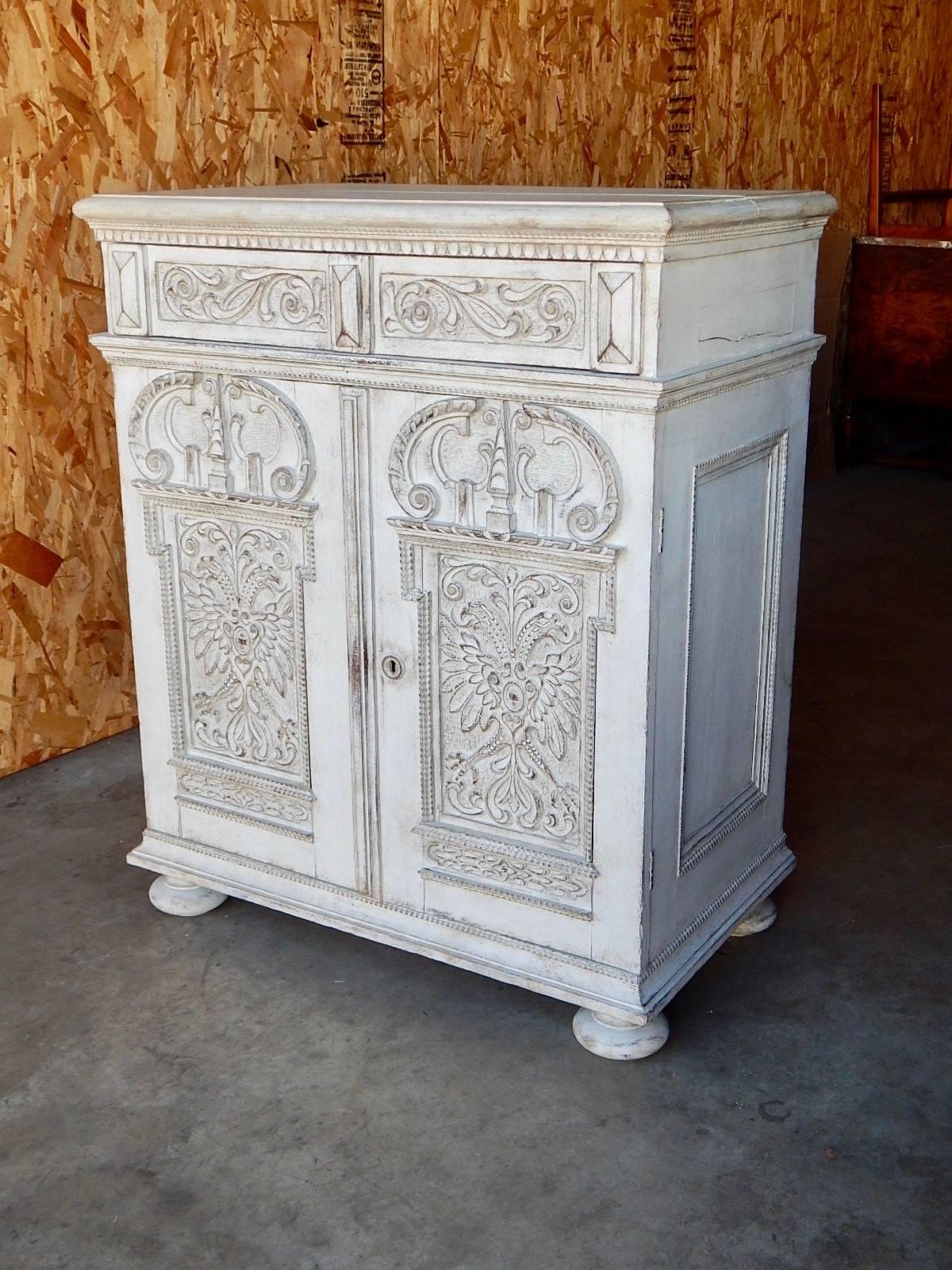Swedish oak storage cabinet in traditional Swedish Gustavian painted finish. Interior is composed of pull out drawers. Some old splitting(see photos). No other structural issues and no wood instability.