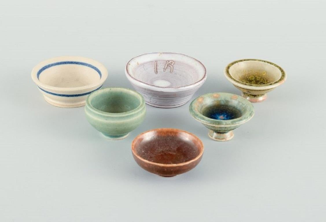 Swedish studio potters, six miniature bowls.
Late 1900s.
Different shapes and glazes.
In perfect condition.
Largest measures D 4.5 cm x H 1.7 cm.