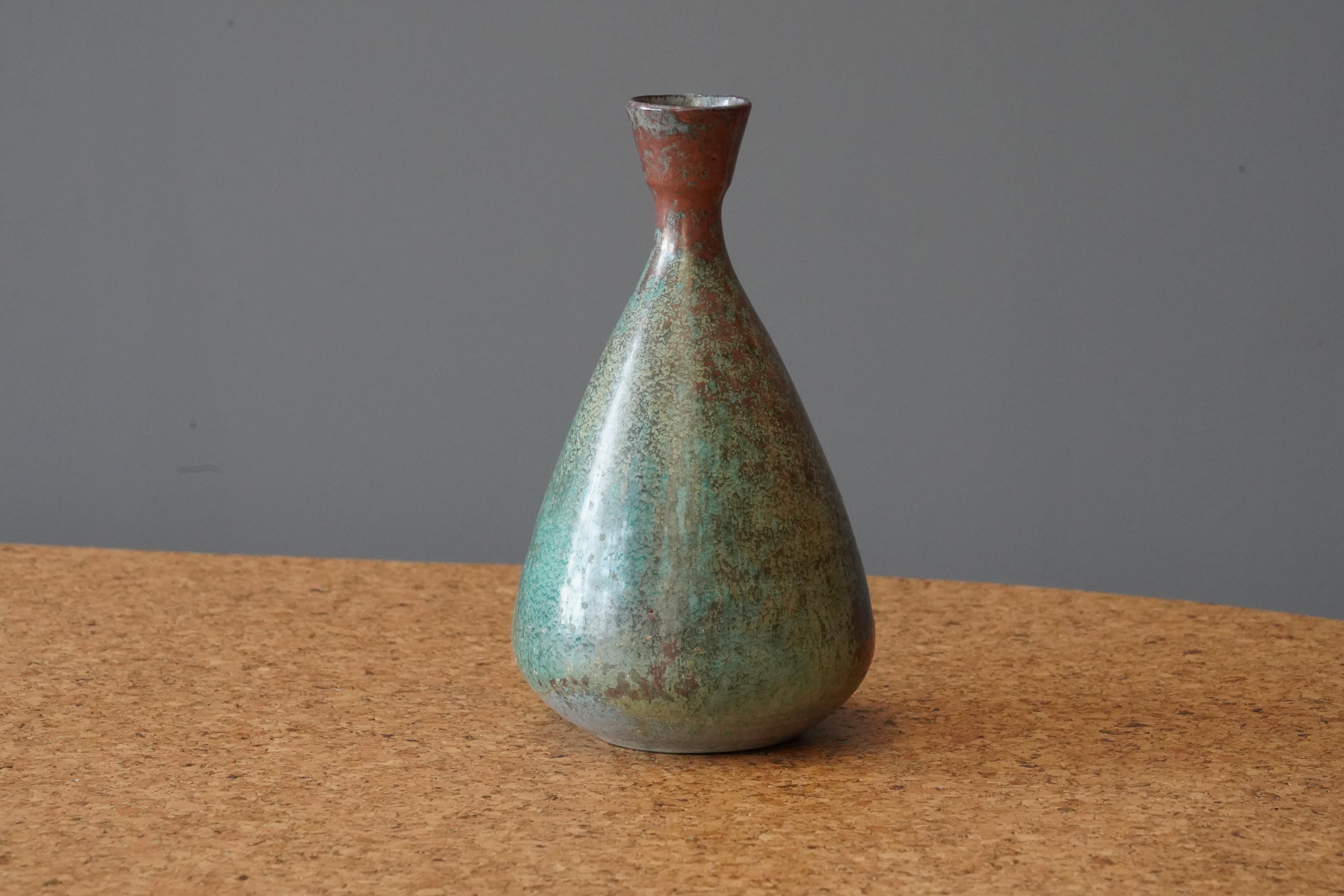 A small organic vase. Designed and produced in Sweden, c. 1960s. Signed.