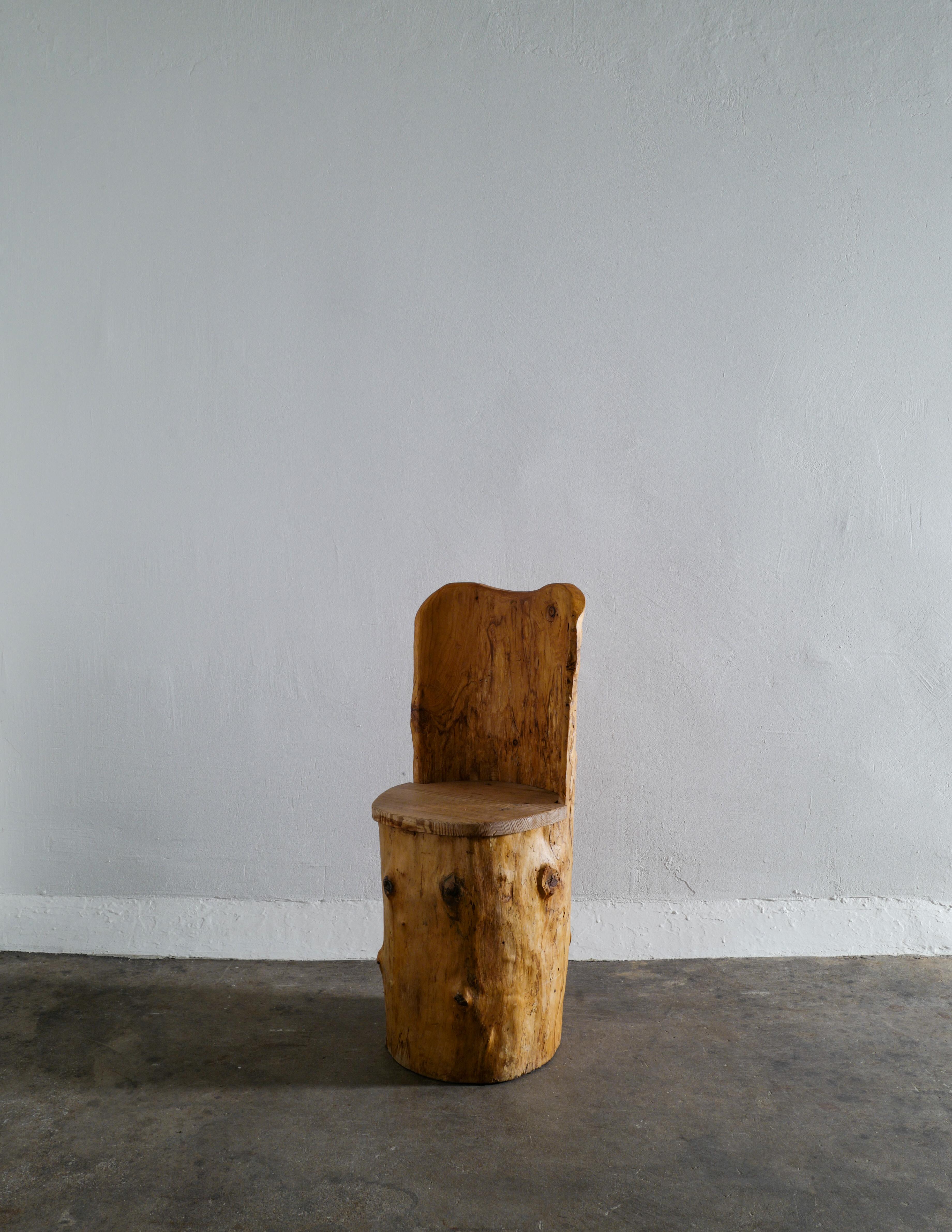 Rare and great example of a Swedish stump chair in pine by an unknown maker from Sweden. 
In good original and vintage condition. A very sculptural piece. 