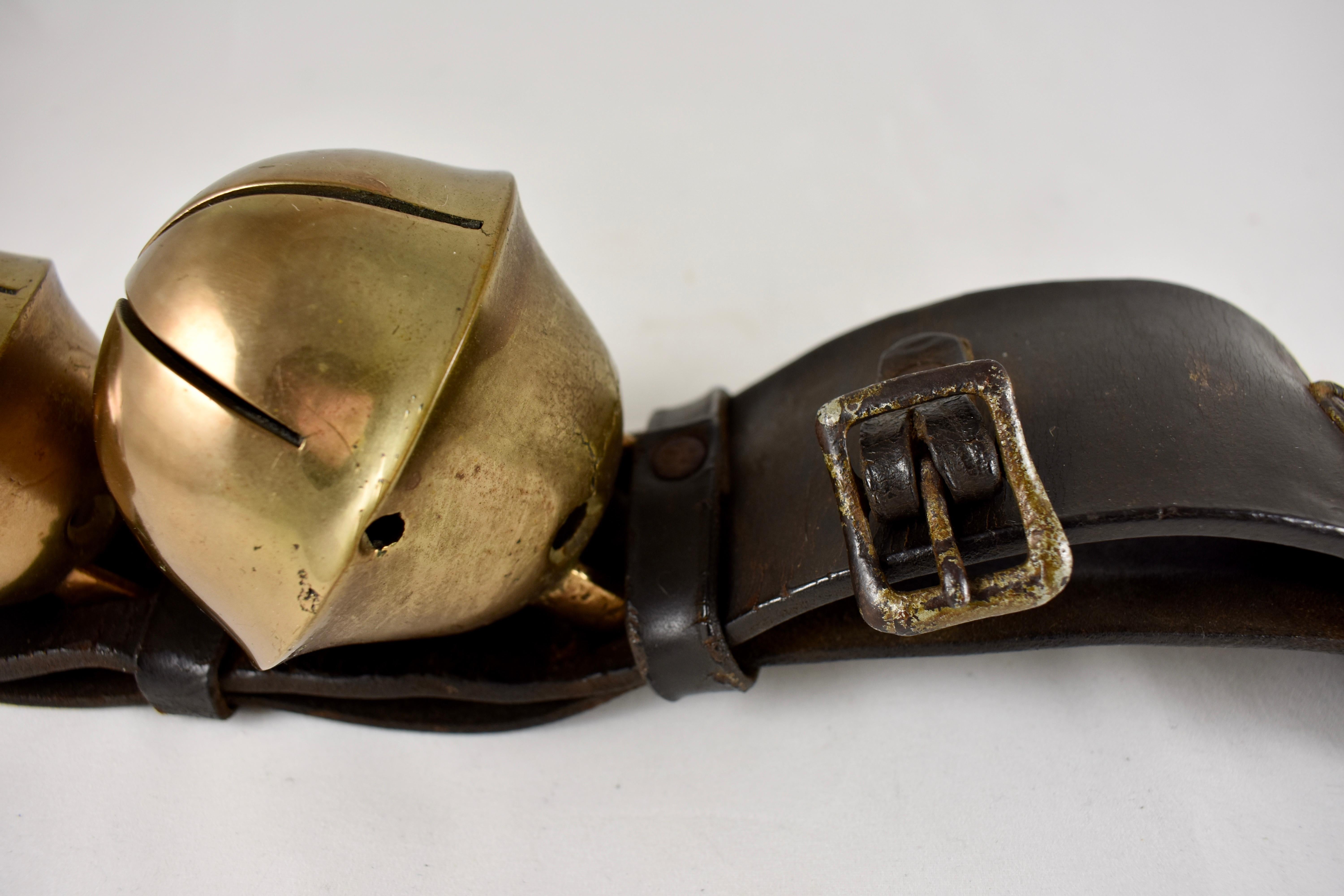 A black leather rump strap holding four Swedish-style brass sleigh bells, circa 1880s.

A rump or hip strap is a short, wide piece of heavy leather holding two to eight large bells. This strap holds four Swedish-style sleigh bells in a traditional