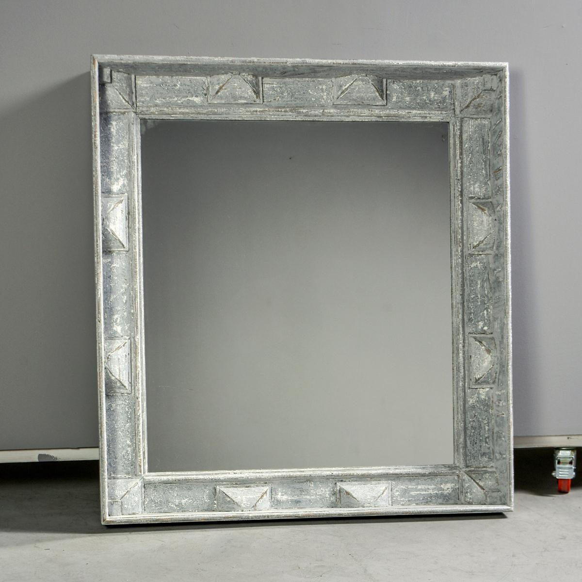 Large European square mirror with painted wood frame, circa 2010. Frame is deep set with decorative details in relief and blue gray paint. Looks Swedish but maker is unknown. 


Measures: Mirror: 34.5” H x 31” W.