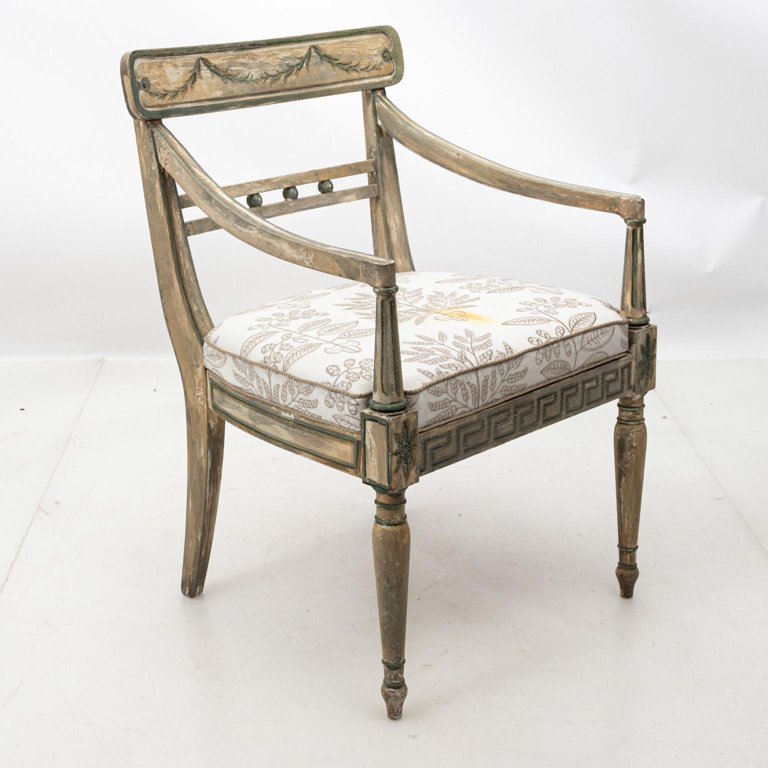 Swedish style painted armchair by Bob Christian with upholstered seat in a distressed finish, circa 1980s-1990s. Please note of wear consistent with age including minor paint loss, chips, and stains on fabric seat.